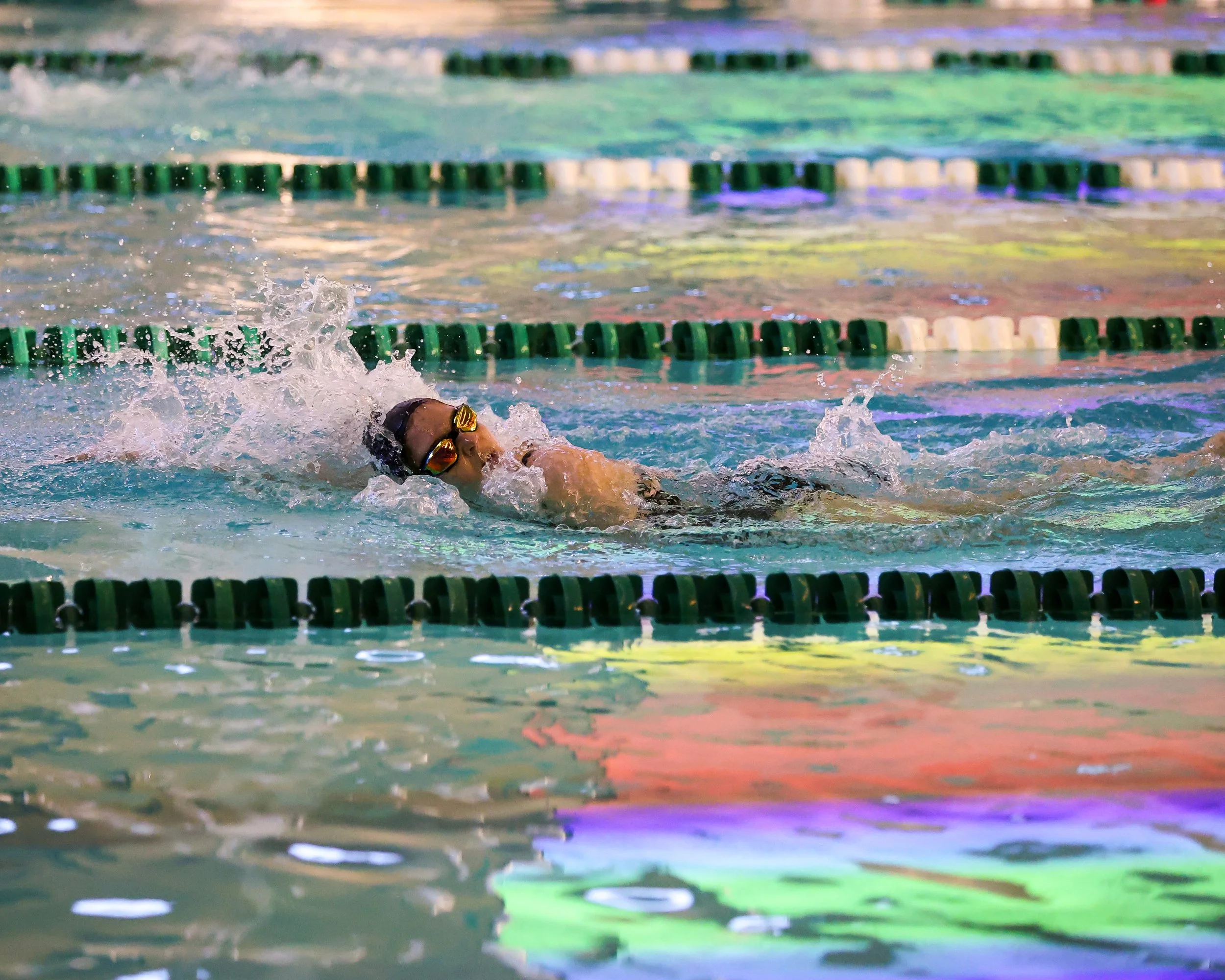 WU swimmer doing the backstroke