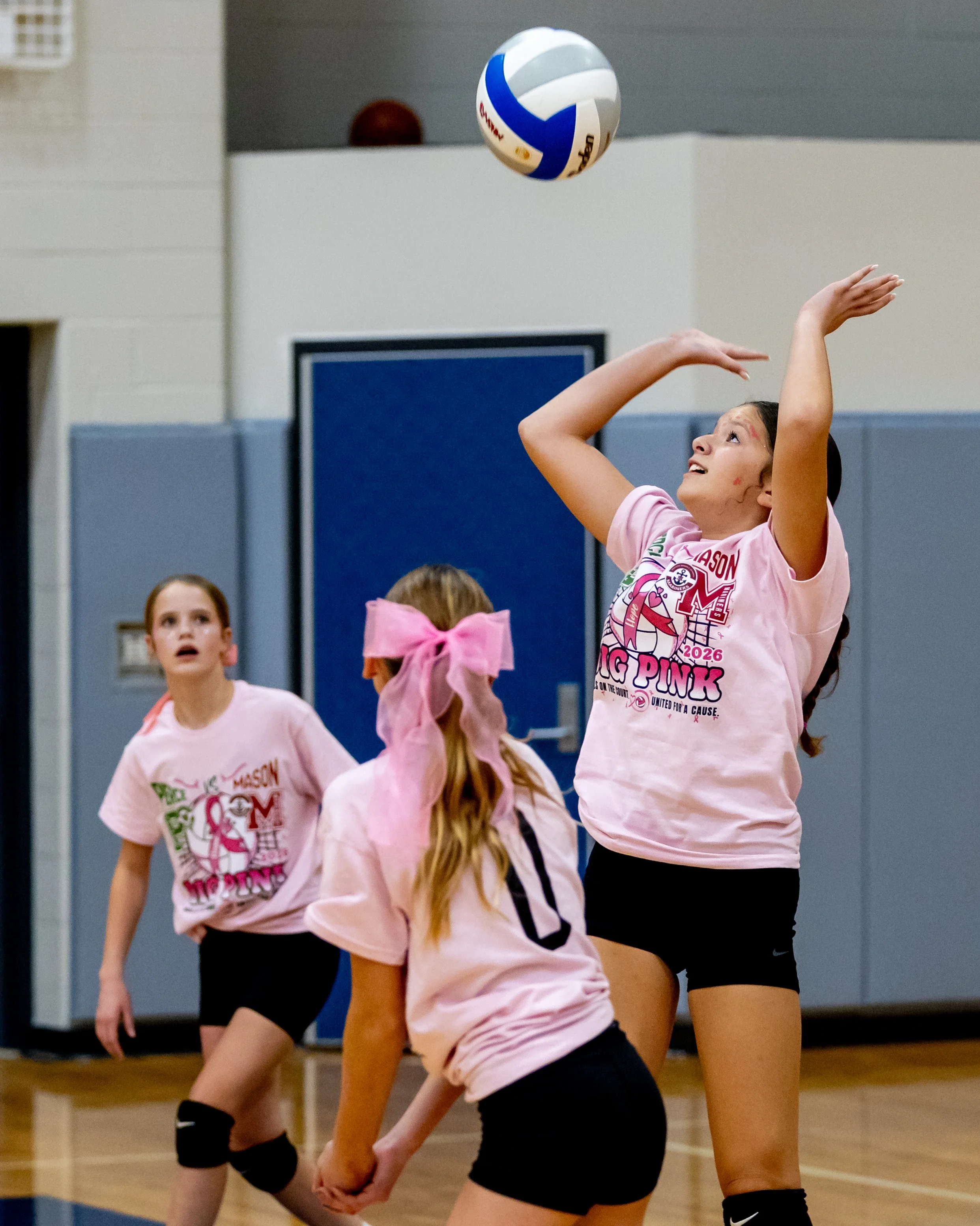Mason player hits the ball