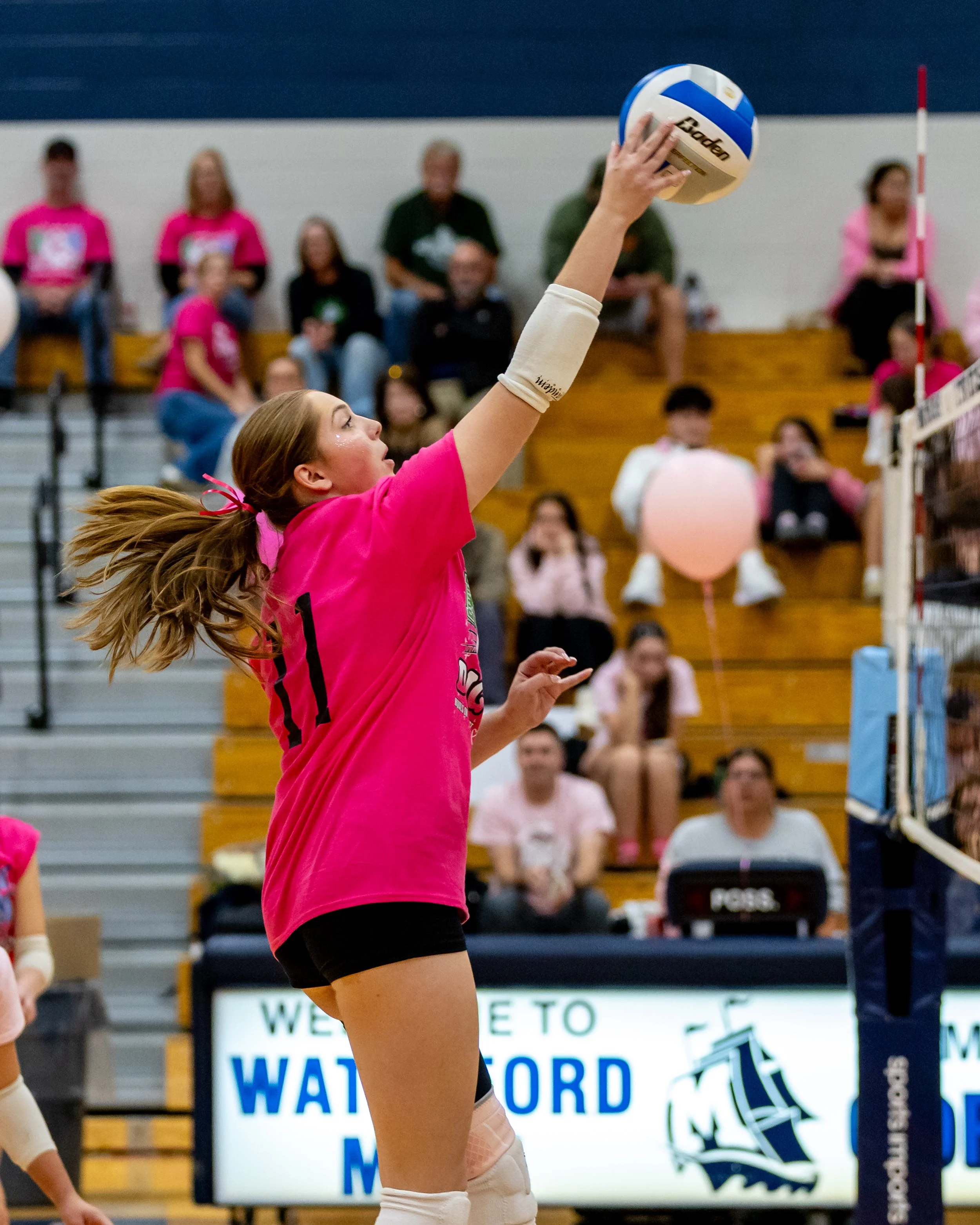 Kettering player hits the ball
