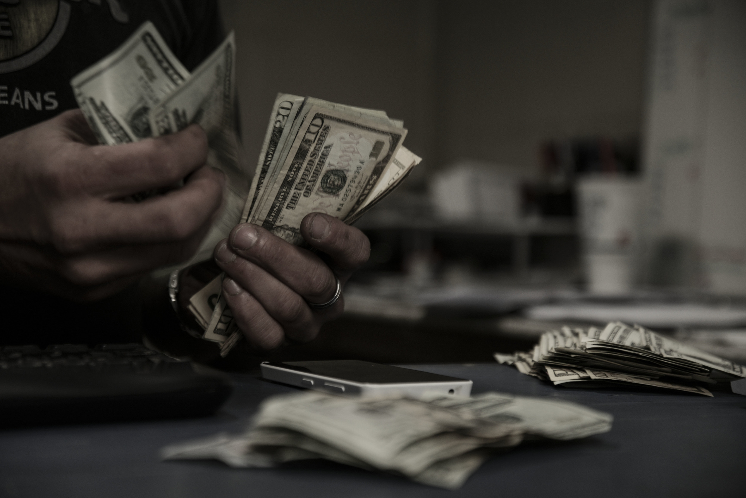  Steve counts his cash after his day of work at Checker Cab Company in downtown Detroit. &nbsp;"Depending on how much cash I make at work that week, depends on how much cash I can put towards buying drugs, basically," he explains.&nbsp;"My boyfriend 