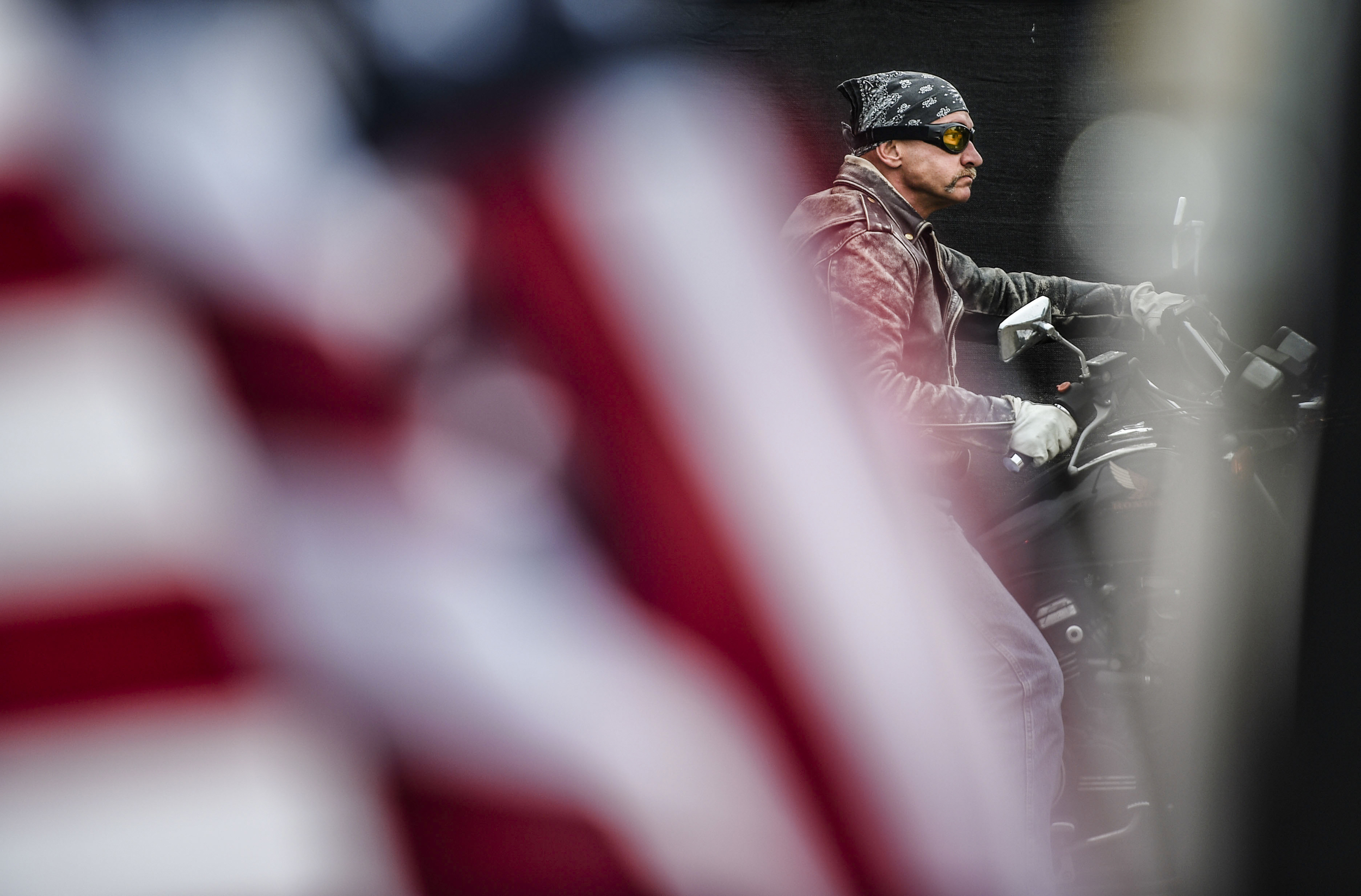  A member of the Patriot Guard Motorcade rides his motorcycle with police and fire agencies to raise the flag in honor of Wounded Warriors, at the Gerald R. Ford Presidential Museum Thursday, Sept. 10, 2015, in Grand Rapids, Mich.&nbsp; 