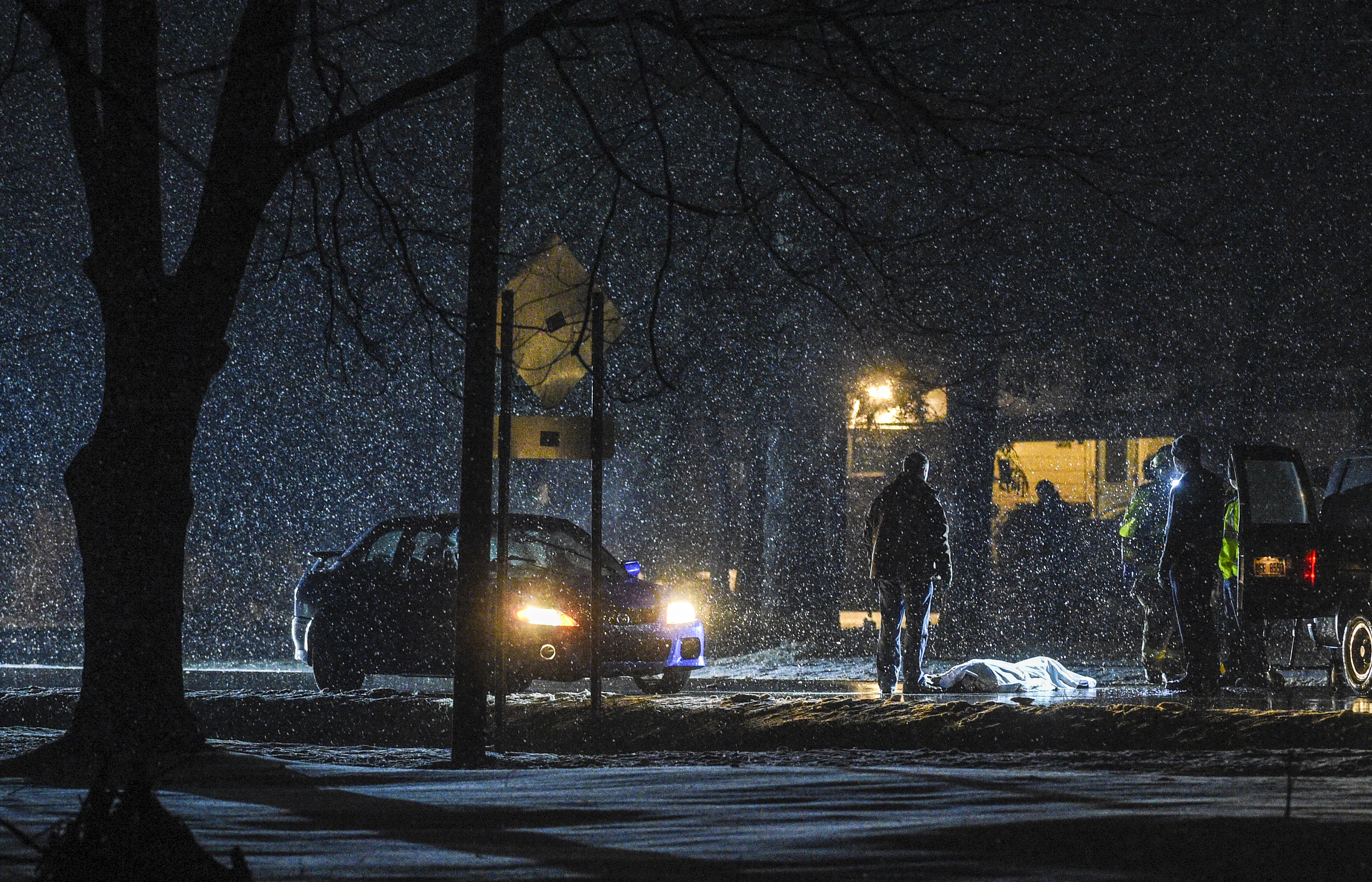  Walker Police cover the deceased body of an 84-year-old man after he was struck and killed while attempting to cross Wilson Avenue Tuesday evening, Dec. 29, 2015, in Walker, Mich. The 19-year-old driver attempted to stop, but could not avoid strikin