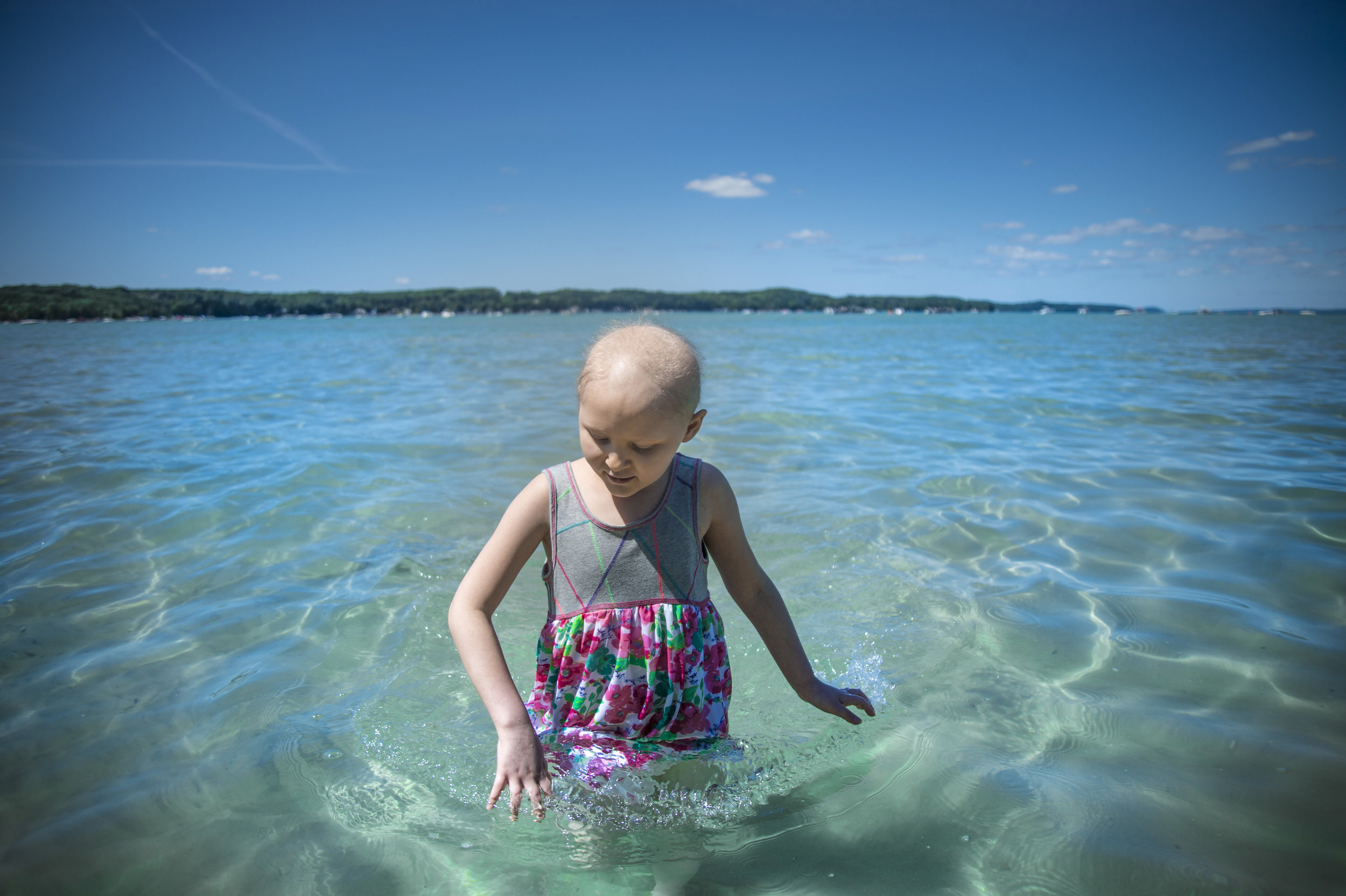  Naomi Wilke, 7, has spent most of her childhood growing up and playing in the clear blue water of Torch Lake. When a blood test revealed she had two types of leukemia, she had to trade her Northern Michigan home for a hospital room in Grand Rapids, 