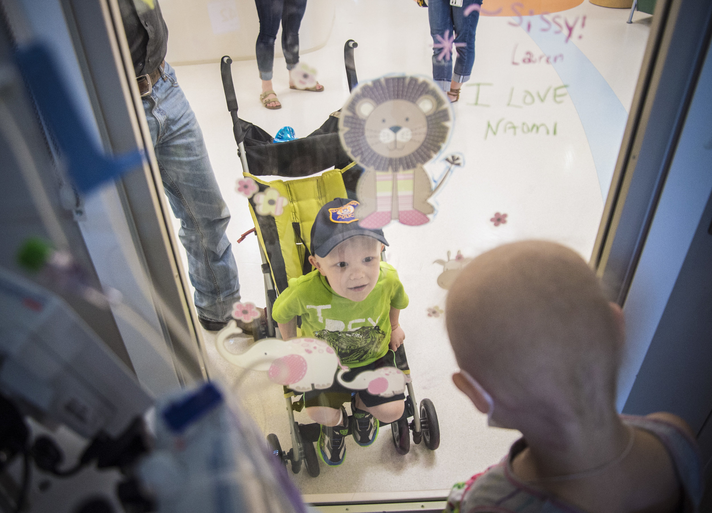  Levi Cafferman, 2, visits Naomi's door to see if she can come out to play. Naomi has to stay in her room in isolation to keep her immune system healthy and free of disease to avoid complications for her bone marrow transplant. Levi is also being tre