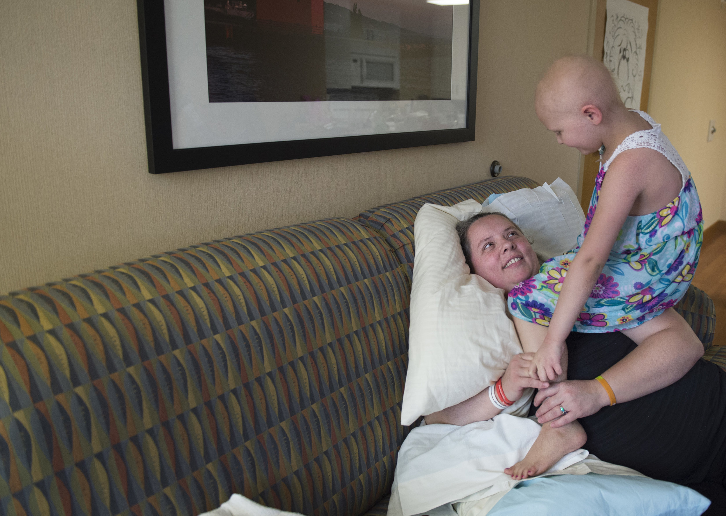  Naomi climbs on her mom while they play together. "We made a lot of good friends and met a lot of good people," Donna says. "You have to find the good in every situation, or it will control you."&nbsp; 