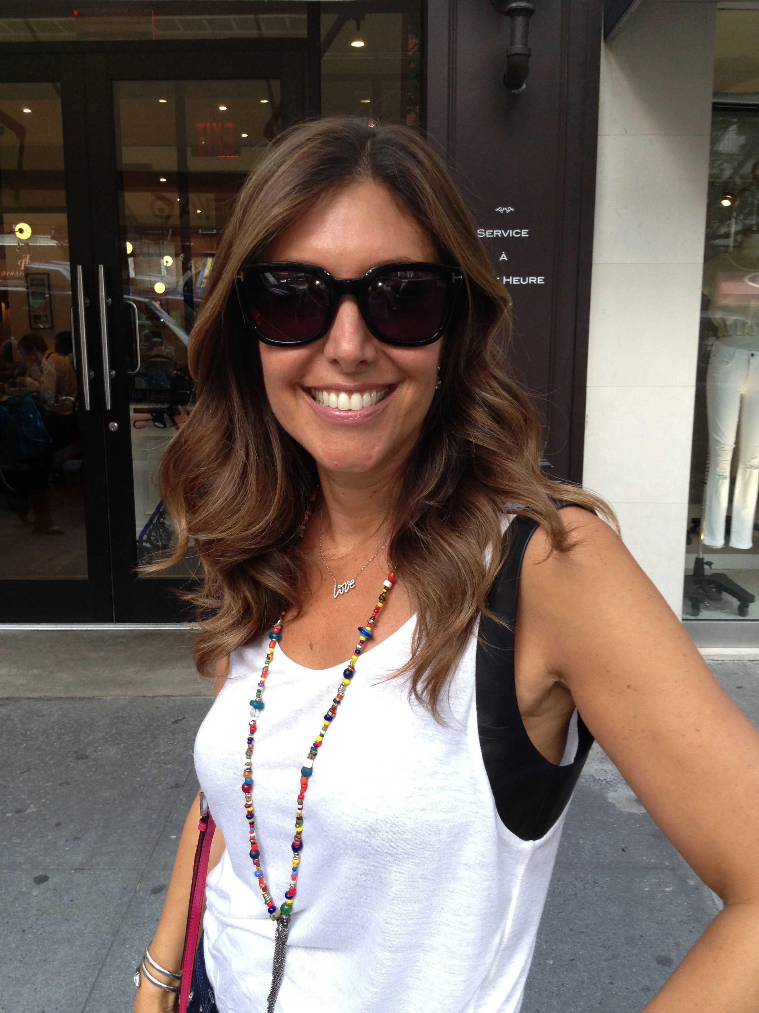 Classic Tom Ford wayfarers with signature "T" logo temple detail, $360. Necklaces: Paloma Picasso Love Pendant from Tiffany & Co., $2,750 , Tribal African Beaded necklace, Nathan & Moe, $175 