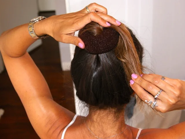 Step 2: Wrap hair and then spread around the bun maker.