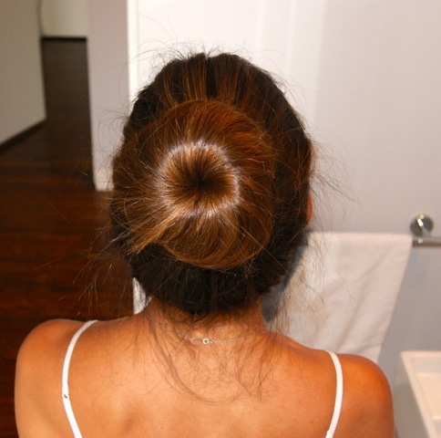 The perfect bun made easy! Use hairspray to secure fly-aways.