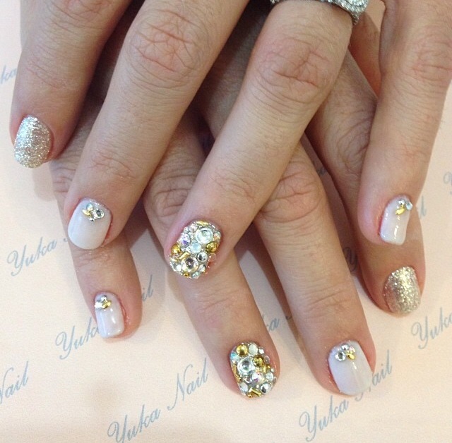 Gel mani using energizing crystal powder with rhinestones.