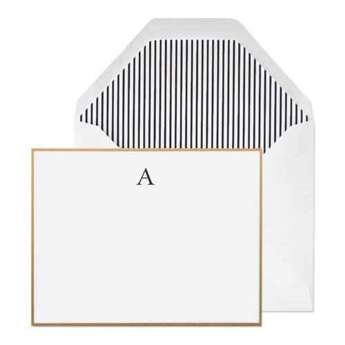 Sugar paper Ashton Monogram, $30.00.&nbsp;Black ink on a bright white card with a gold border, paired with a white envelope and black and white pinstripe liner.&nbsp;6 flat&nbsp;cards + 6 envelopes. Dimensions: 5.5 x 4.25 inches