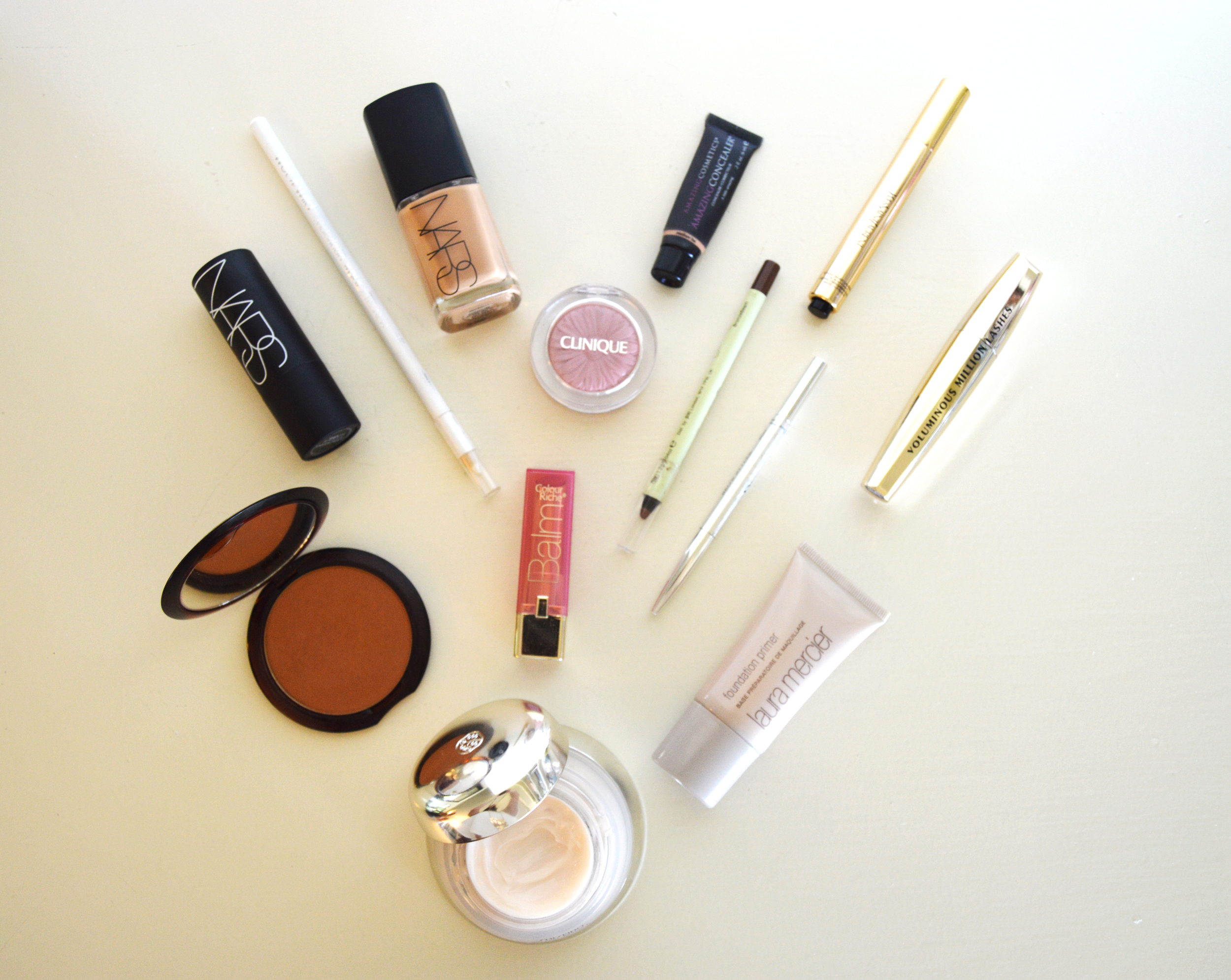 Shiseido Revitalizing Cream , Laura Mercier Foundation Primer , Guerlain Terra Cotta Bronzer , L'oreal Paris Colour Riche lipstick in Heavenly Berry, Dior Brow Styler , Pixi Eye Pen , Clinique Cheek Pop Blush , NARS Sheer Glow Foundation , NARS Multi Purpose Stick, Wet N Wild White Kohl Eyeliner , Amazing Cosmetics Concealer , Y SL Touche Eclat, L'oreal Voluminous Million Lashes