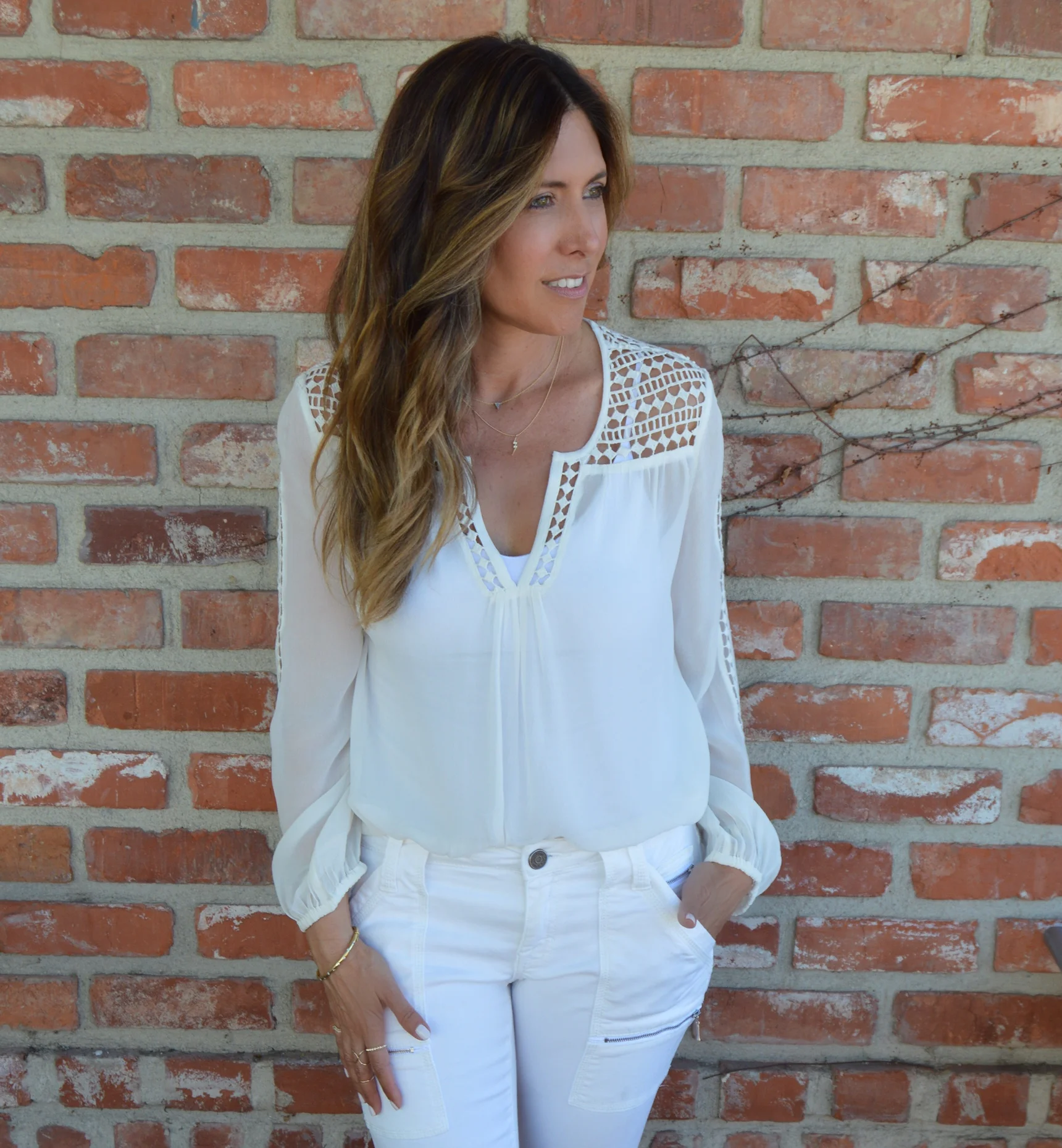 Melissa Meyers in Joie Leblanc blouse, skinny jean & boot with Cosabella Camisole & Chloe Drew Medium Bag