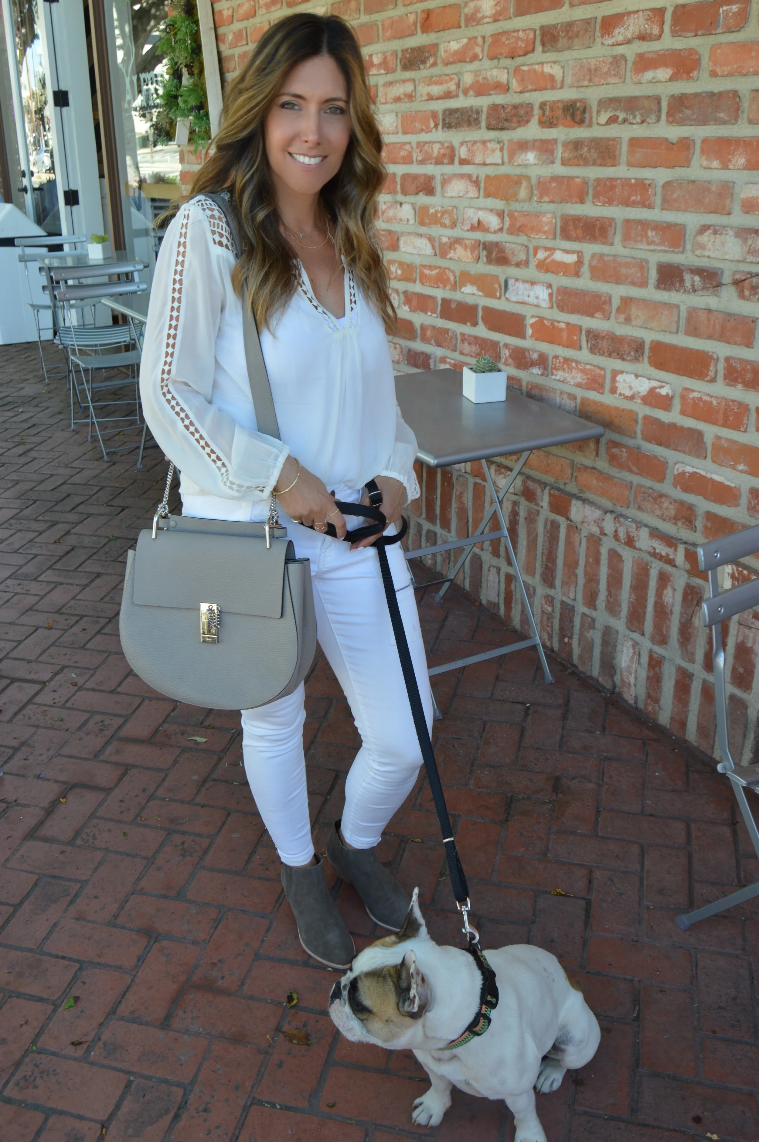 Melissa Meyers in Joie Leblanc blouse, skinny jean & boot with Cosabella Camisole & Chloe Drew Medium Bag