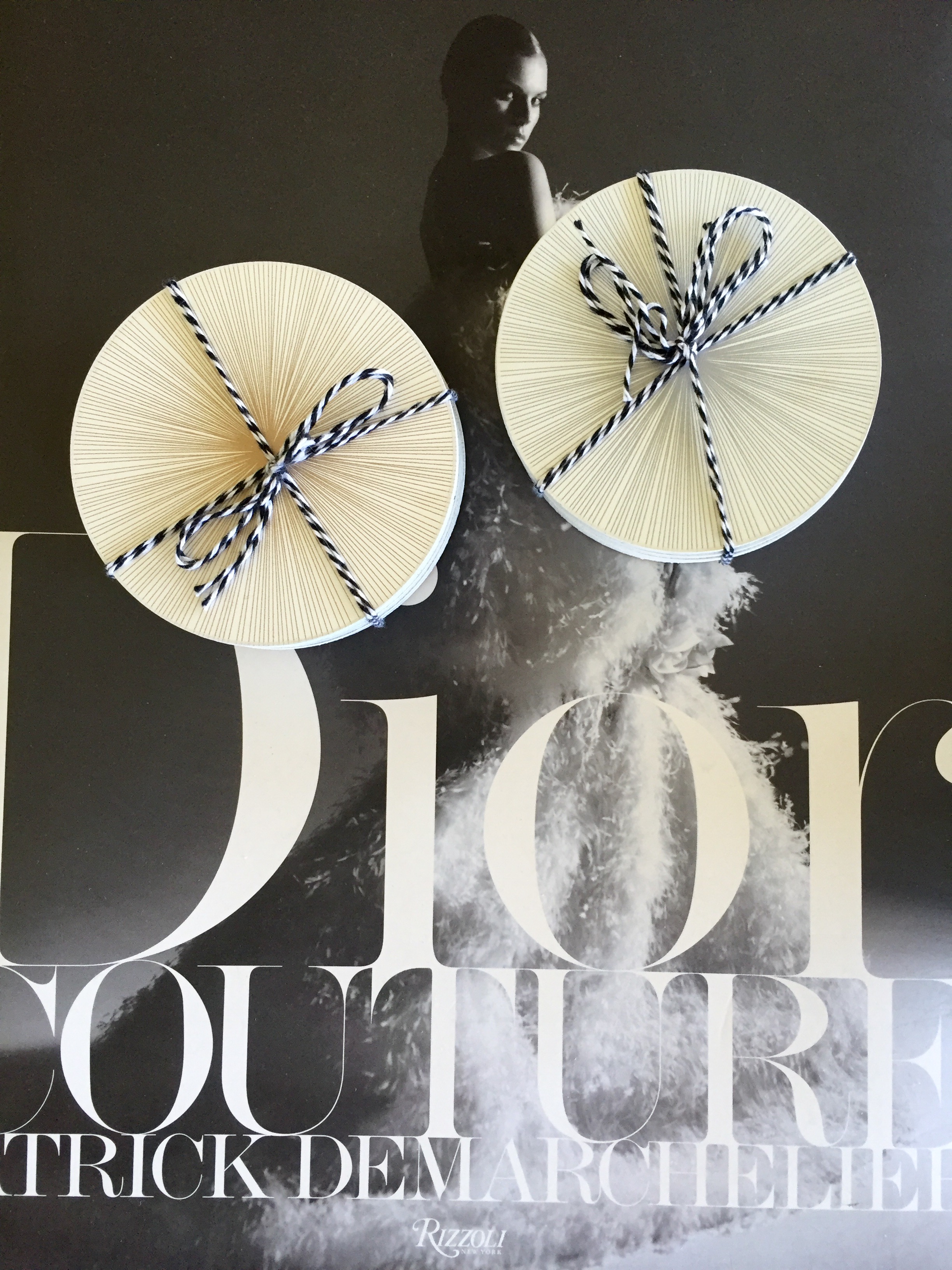 Tisch graphic lines coasters shown in gold and silver. I purchased these in advance and styled them here on top of my favorite coffee table book, "Dior Couture" by famed photographer Patrick Demarchelier, $98. They are sold individually and come in different colors and patterns.