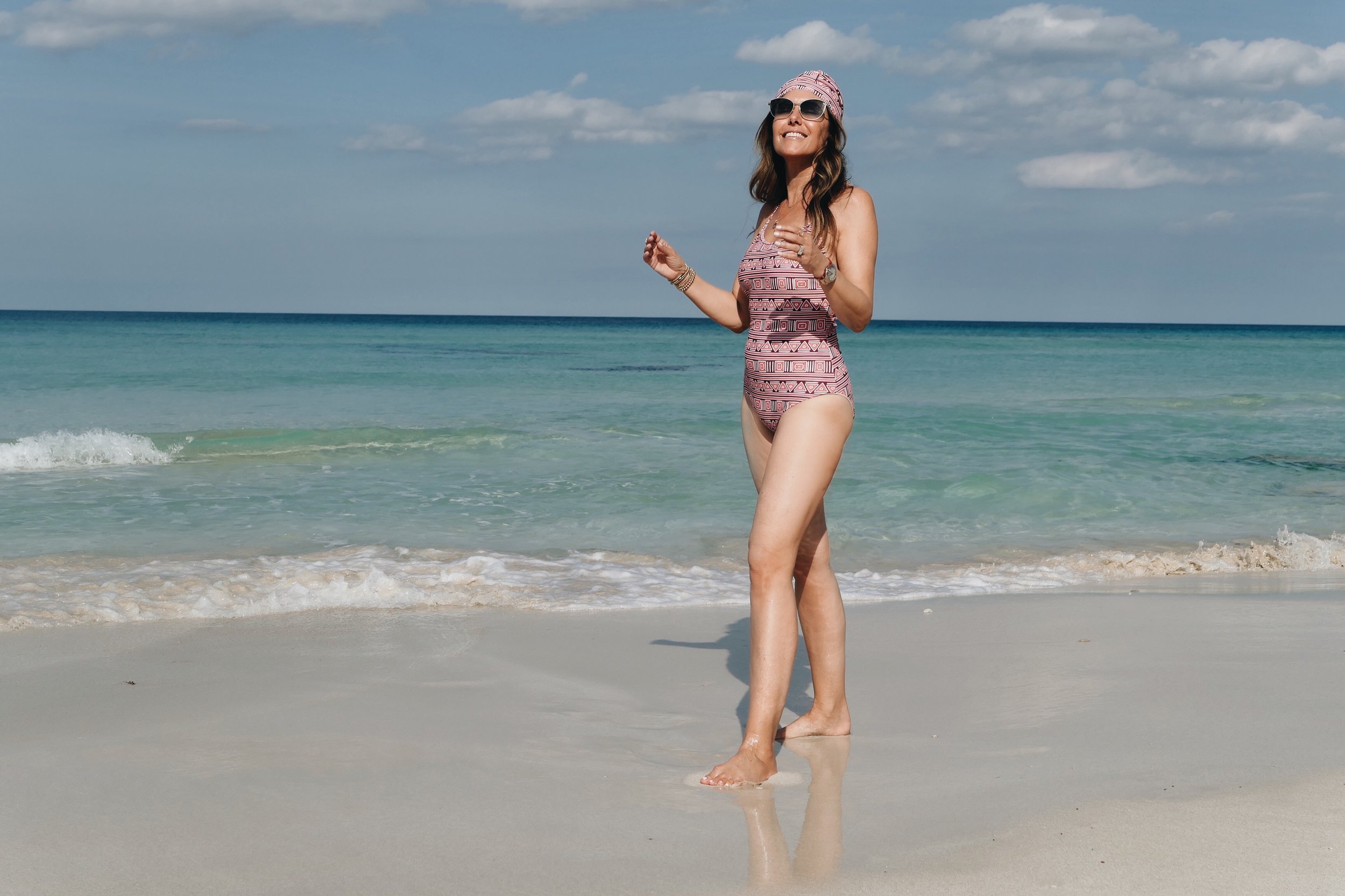 Beach day at Miya Cayito. Melissa wearing Mott50 X Margherita one piece swim suit.