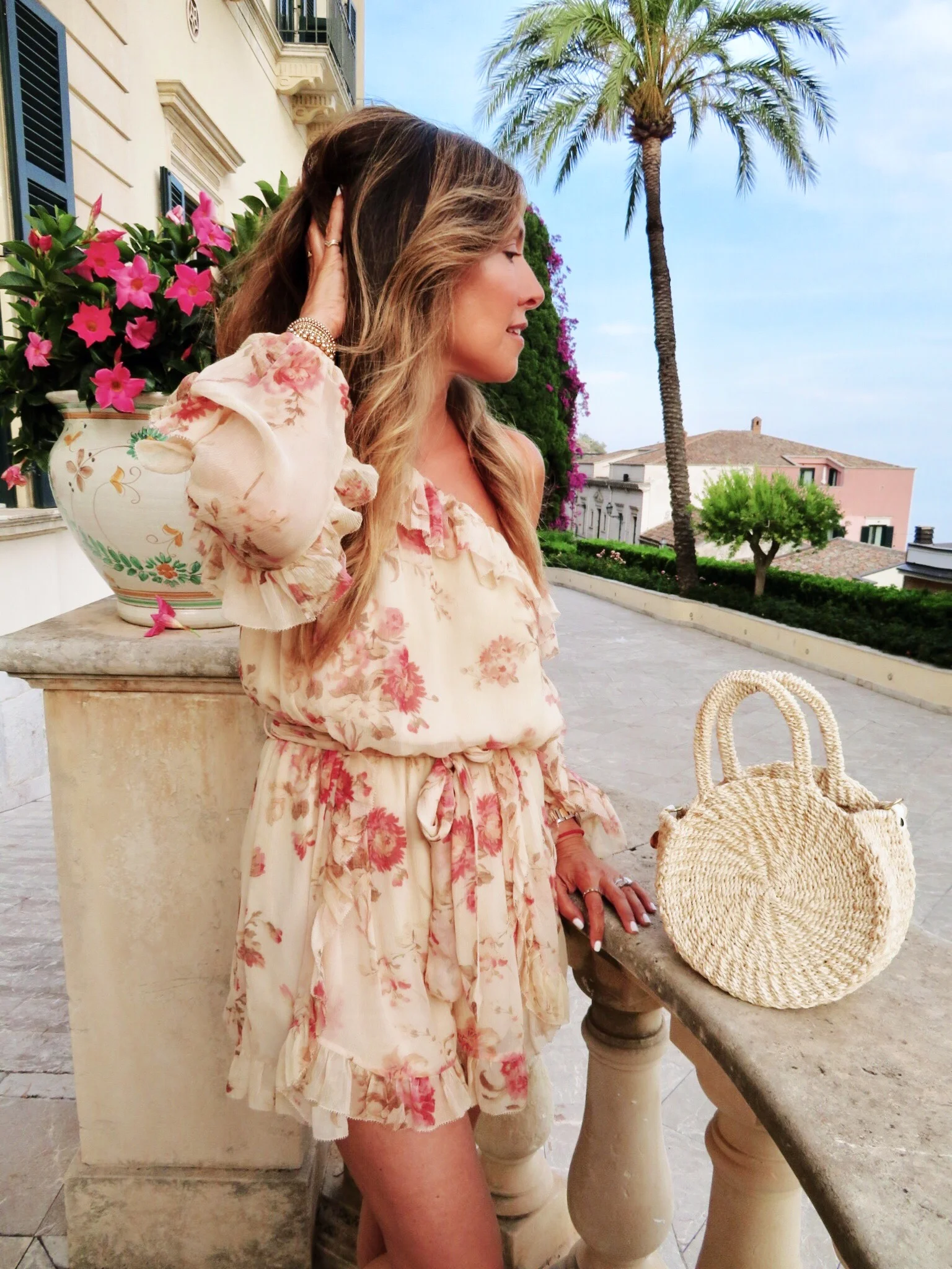 Belmond Grand Hotel Timeo. Wearing a Zimmerman ruffled floral playsuit. Similar here.