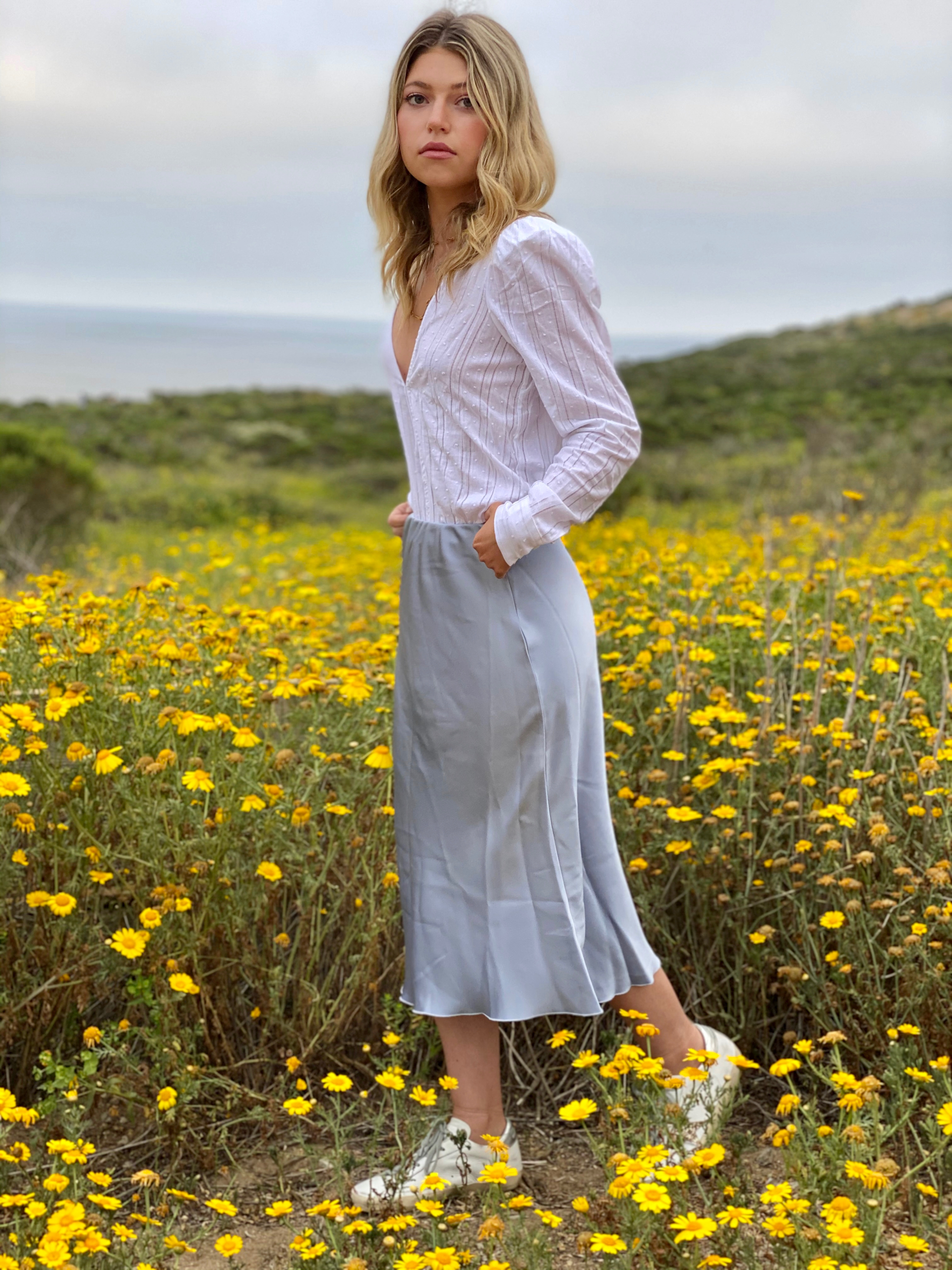 Top by Danielle Bernstein We Wore What. SHOP Similar Love Shack Fancy.  Nanushka skirt. SHOP Similar: Vince Skirt