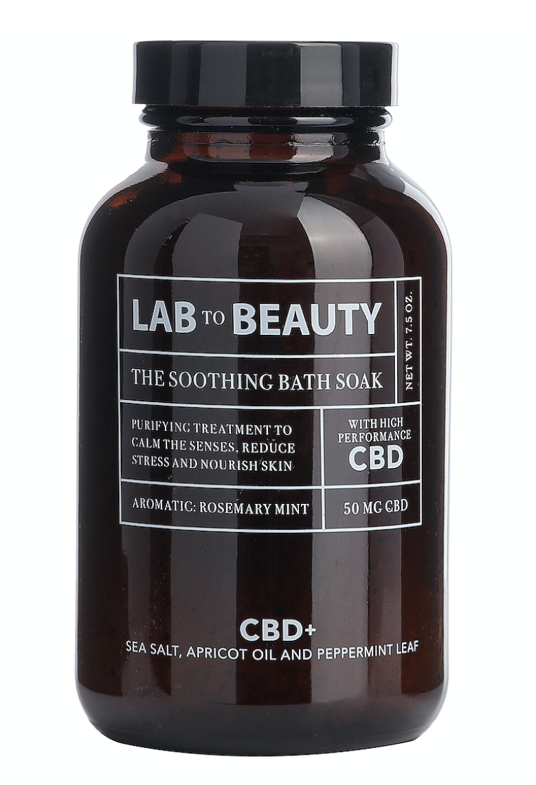 Lab To Beauty Soothing Bath Soak - Formulated with high-performance CBD, Dead Sea Salt, and Apricot Oil, it works to rebalance and remineralize skin, while fighting inflammation.