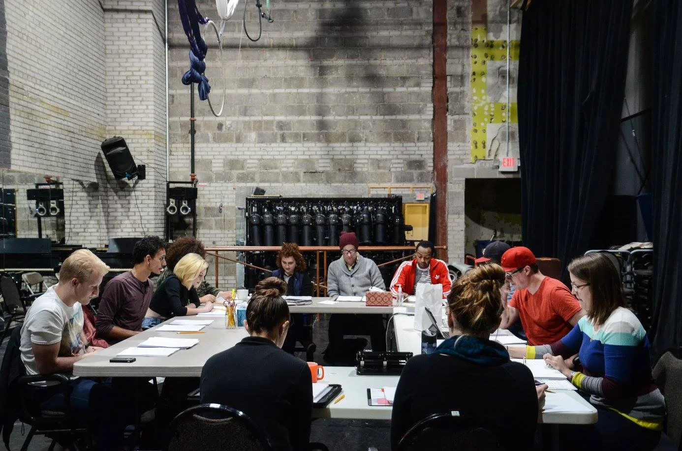 Actors and crew reading the new edits during rehearsal | Photography by Theater Latte' Da
