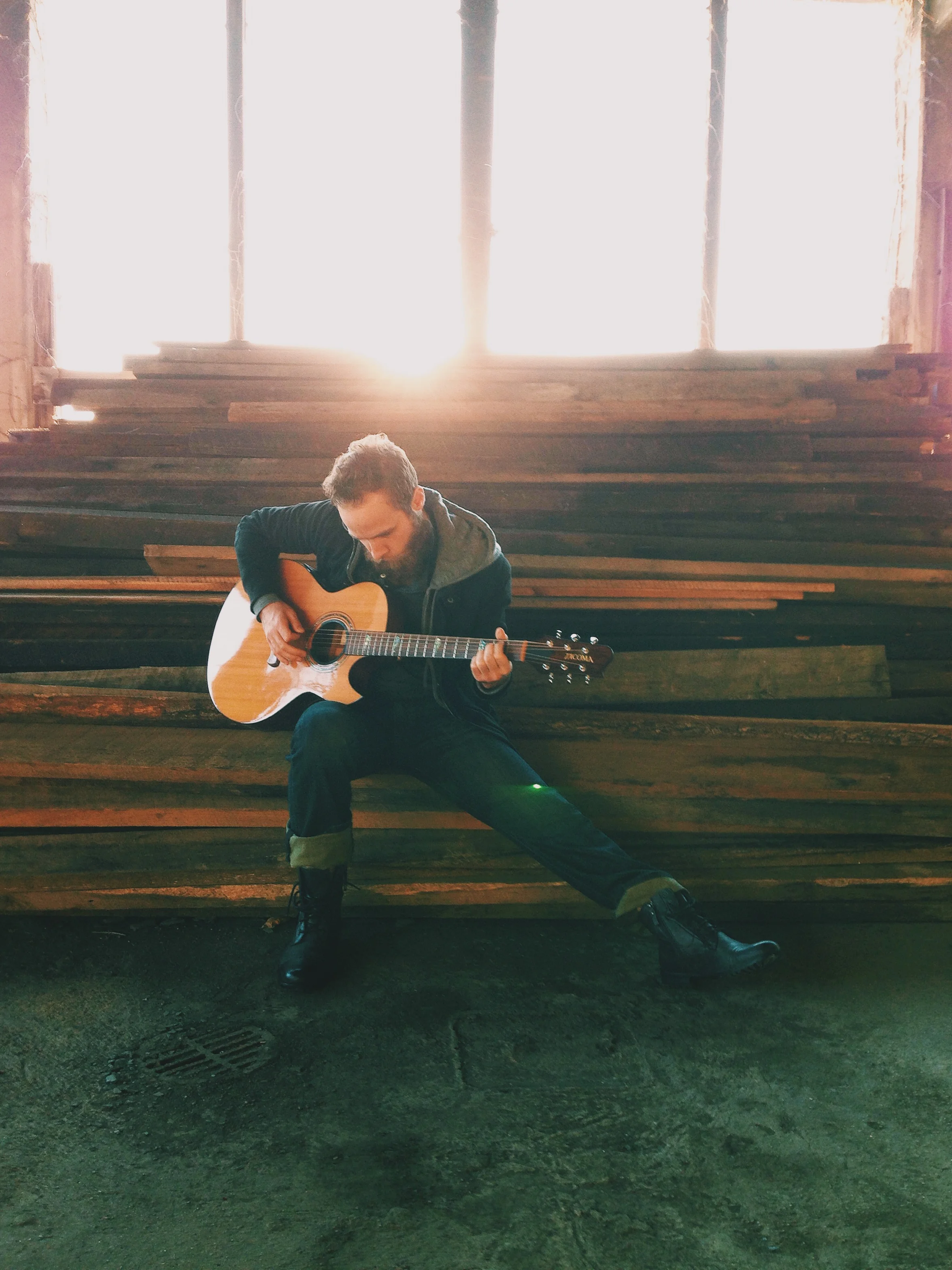 Jase Hackman with his guitar