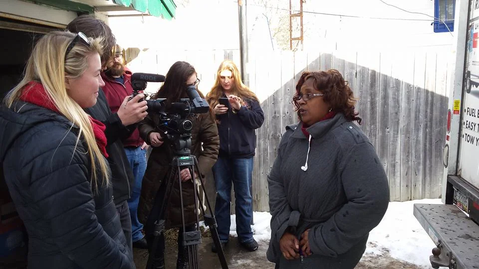 Elise prepares her shot for the next interview in Flint, MI Lauren Selewski - Photo Credit