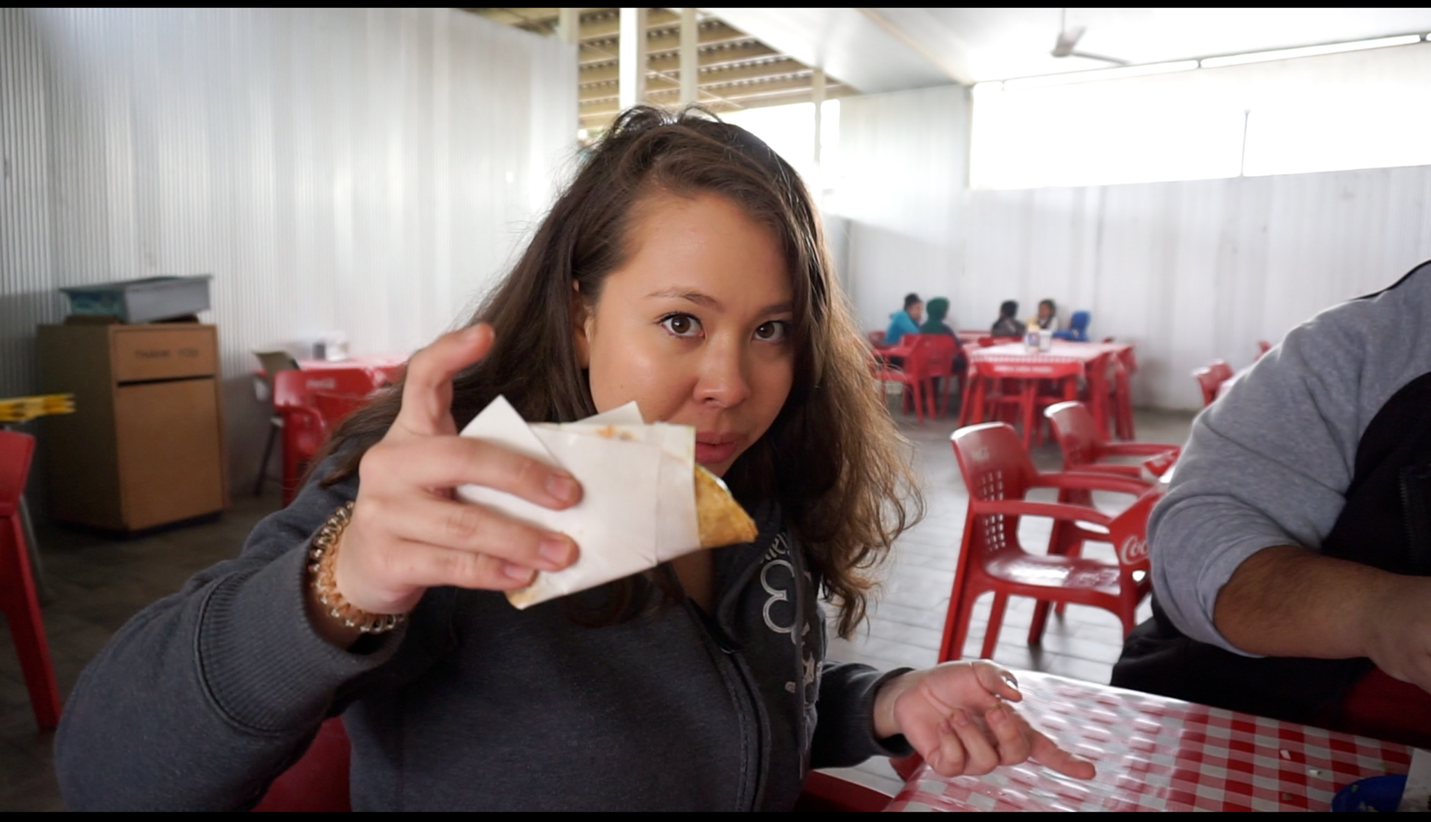 Diana holding a gluten free taco