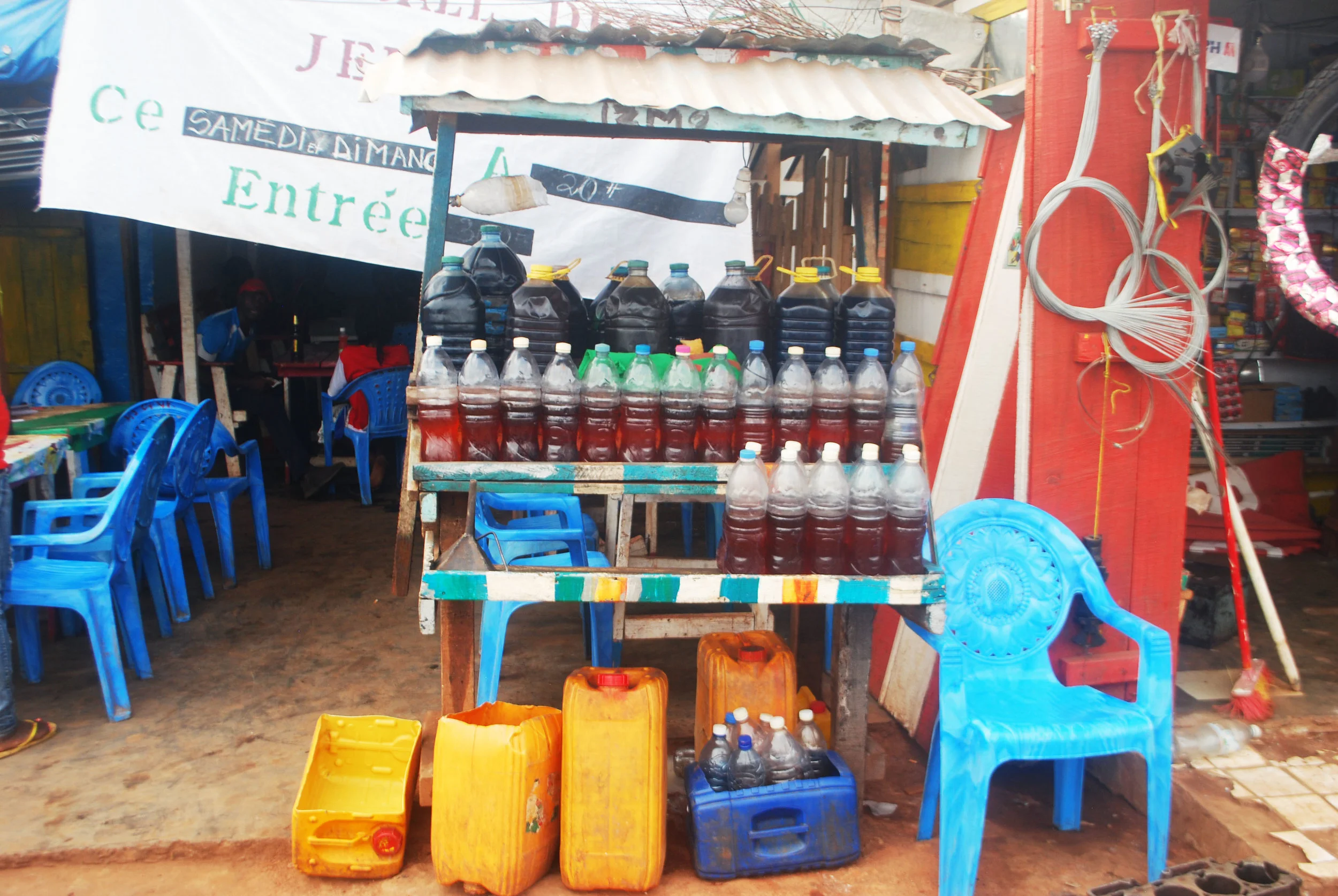A gas station on the main road near Boali Falls. Gasoline is purchased in Bangui, driven up the highway in gas canisters, and partitioned into minuscule amounts in water bottles for sale to those unlucky enough to run out of fuel before reaching Bangui. The entrance to the restaurant where we had lunch is visible on the left.