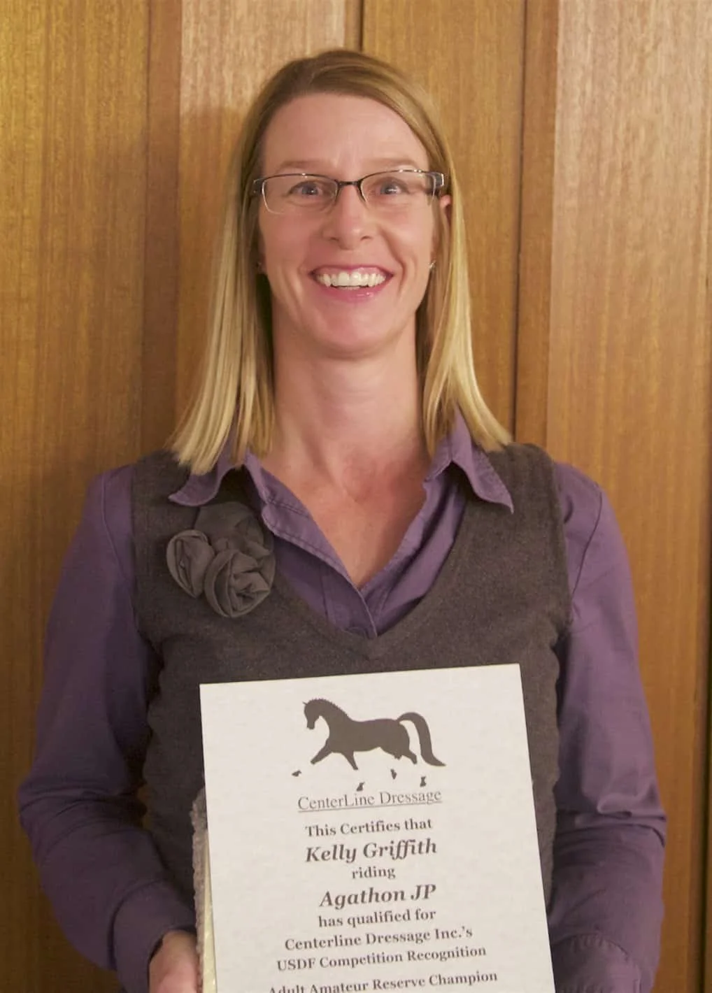 Kelly Griffith accepts an award