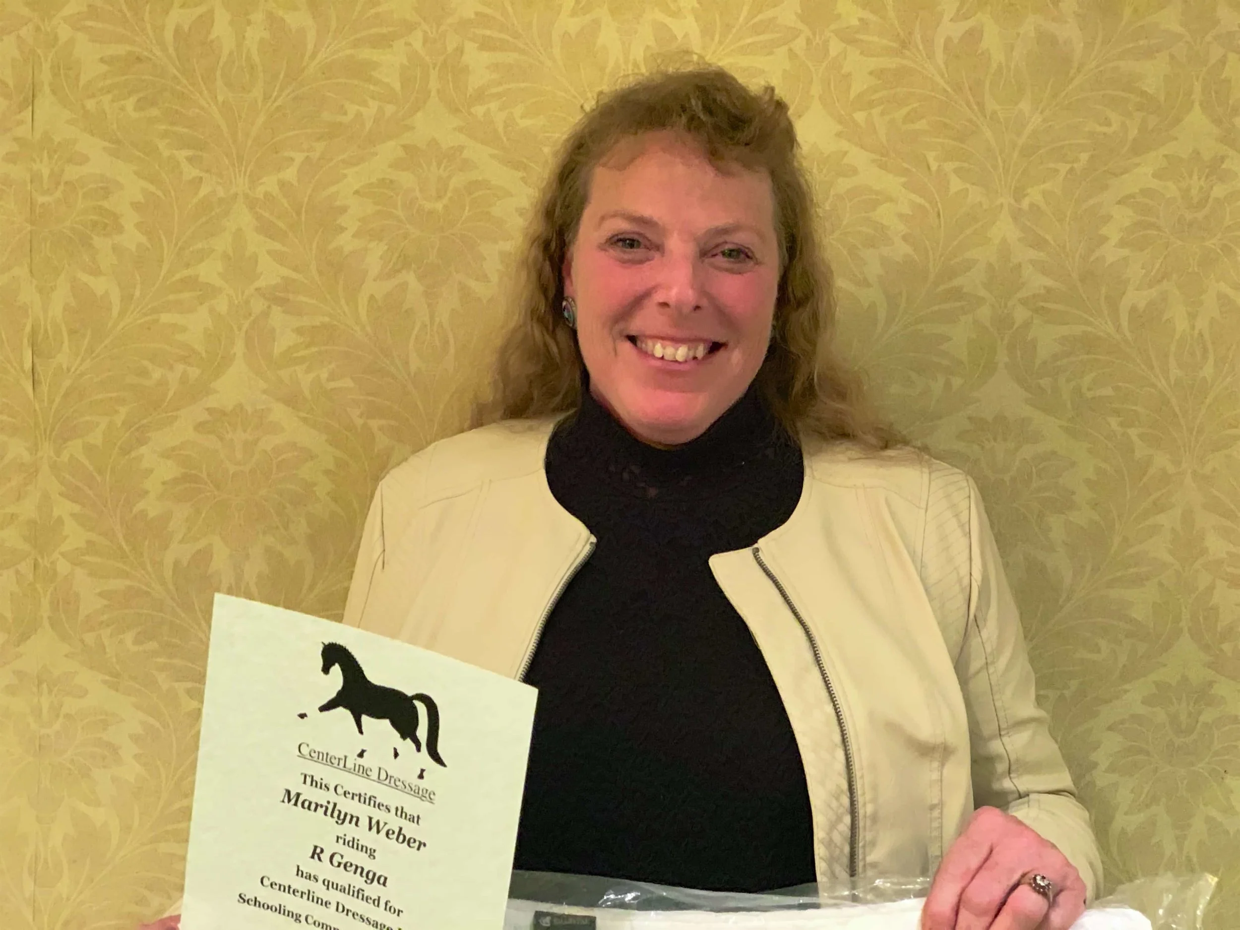 CLD Director Marilyn Weber receiving one of her awards