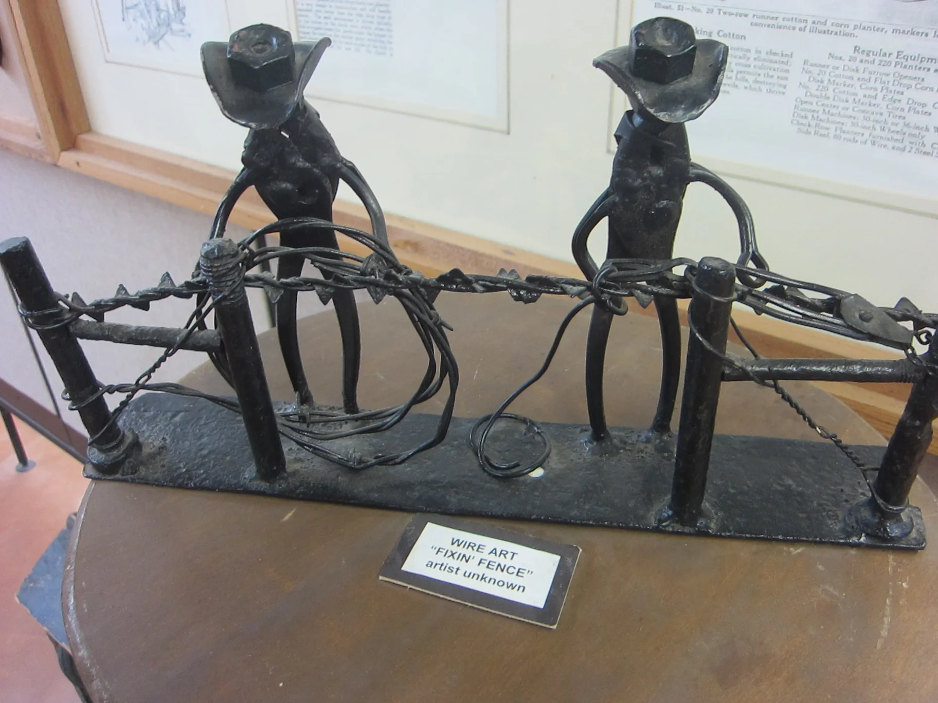 Cowboys Making a Barbed Wire Fence