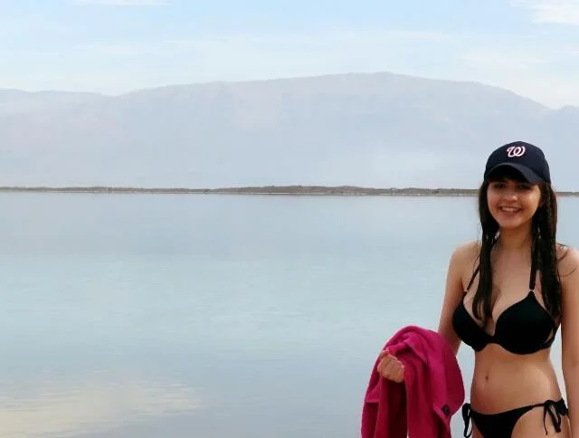 Standing in front of the Dead Sea