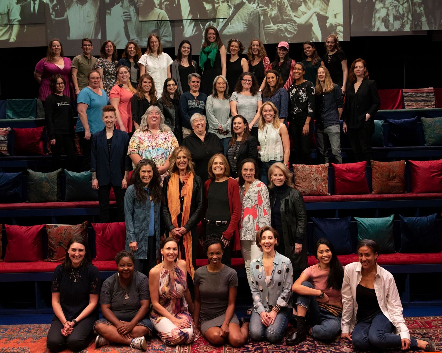 source - Gloria Steinem is actually in this picture: second row from the bottom, in the middle in a red cardigan.