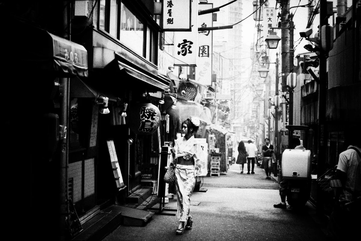 "yukata girl walking down memory lane", Shinjuku, Tokyo, 2011.