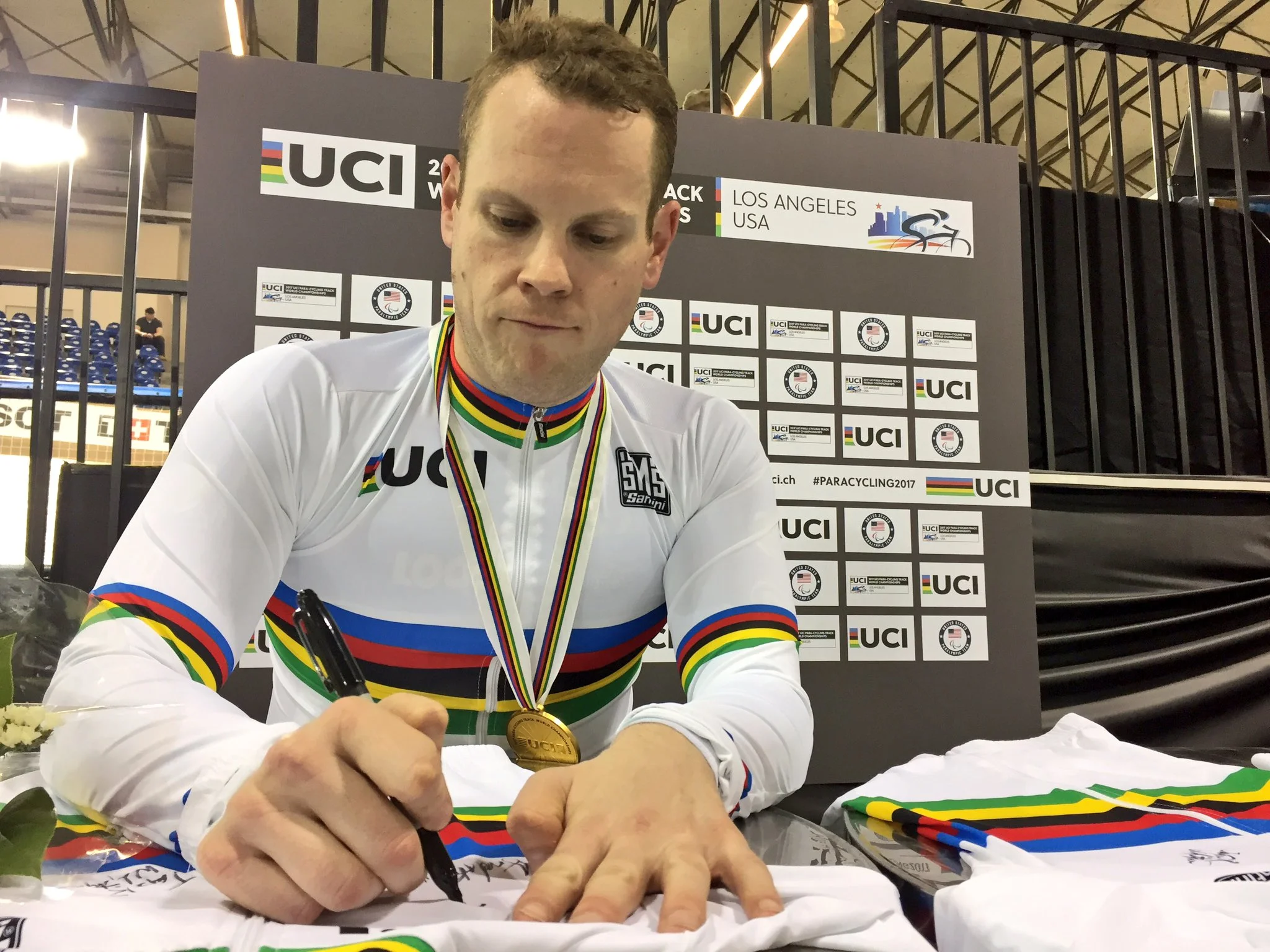 Ross Wilson signing his first (but not only) championship jersey of the 2017 Para World Track Cycling Championships.
