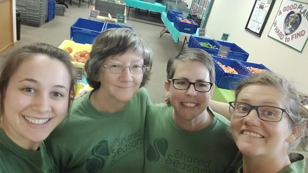 Shared Seasons Pride! Left: Micaela & Carolyn = CSA pick up day lifesavers and total rock stars! Right: Mel = newsletter recipe guru and S.S. test kitchen chef & Sara = person least likely to work on Thursday!