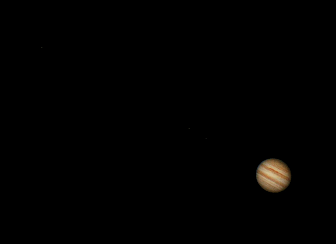 This is an image of Jupiter found in the bottom right. Ganymede, Io, and Europa are the moons seen left to right.