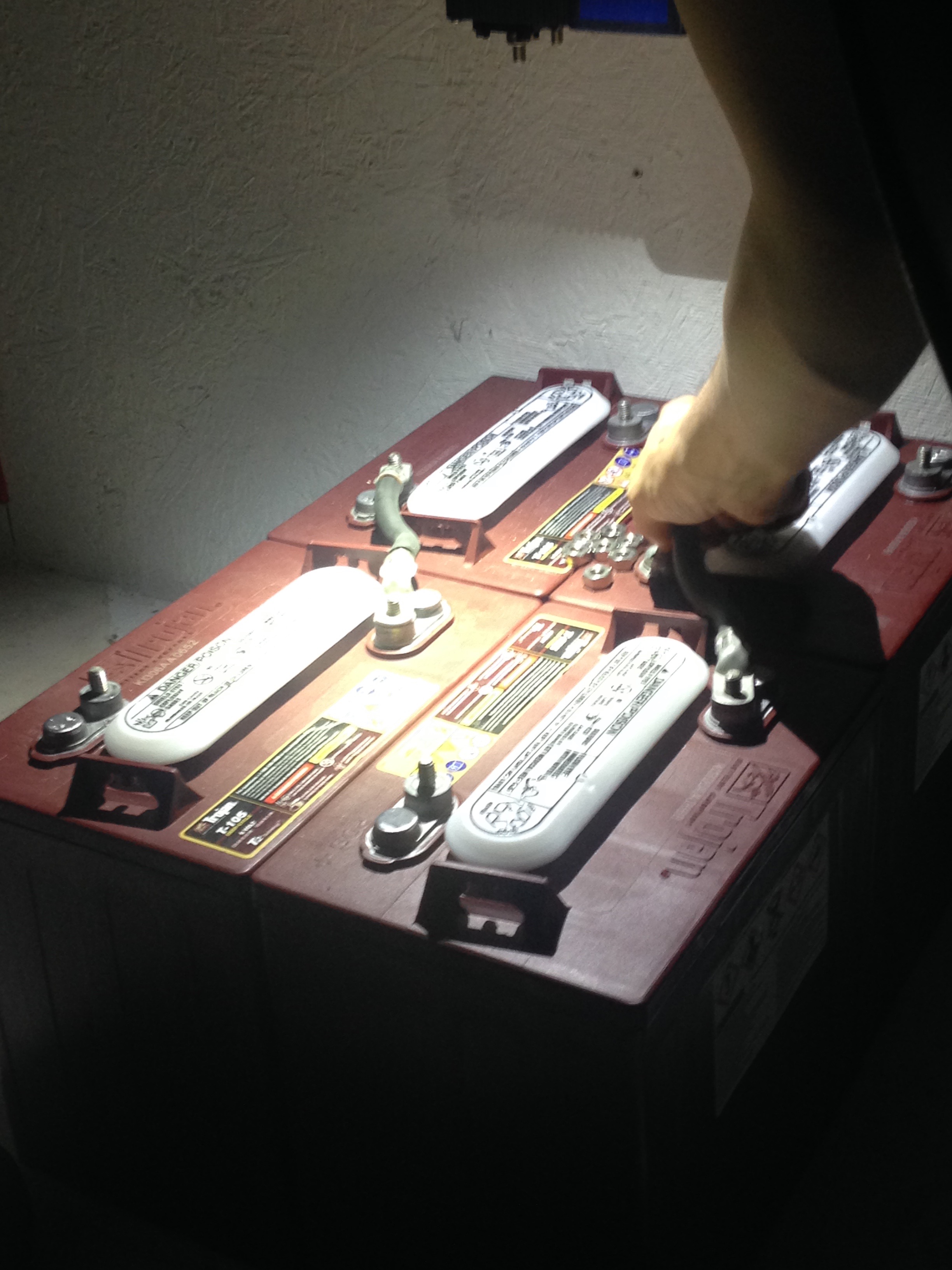 Test-fitting the 1-aught wire connecting the batteries together. 