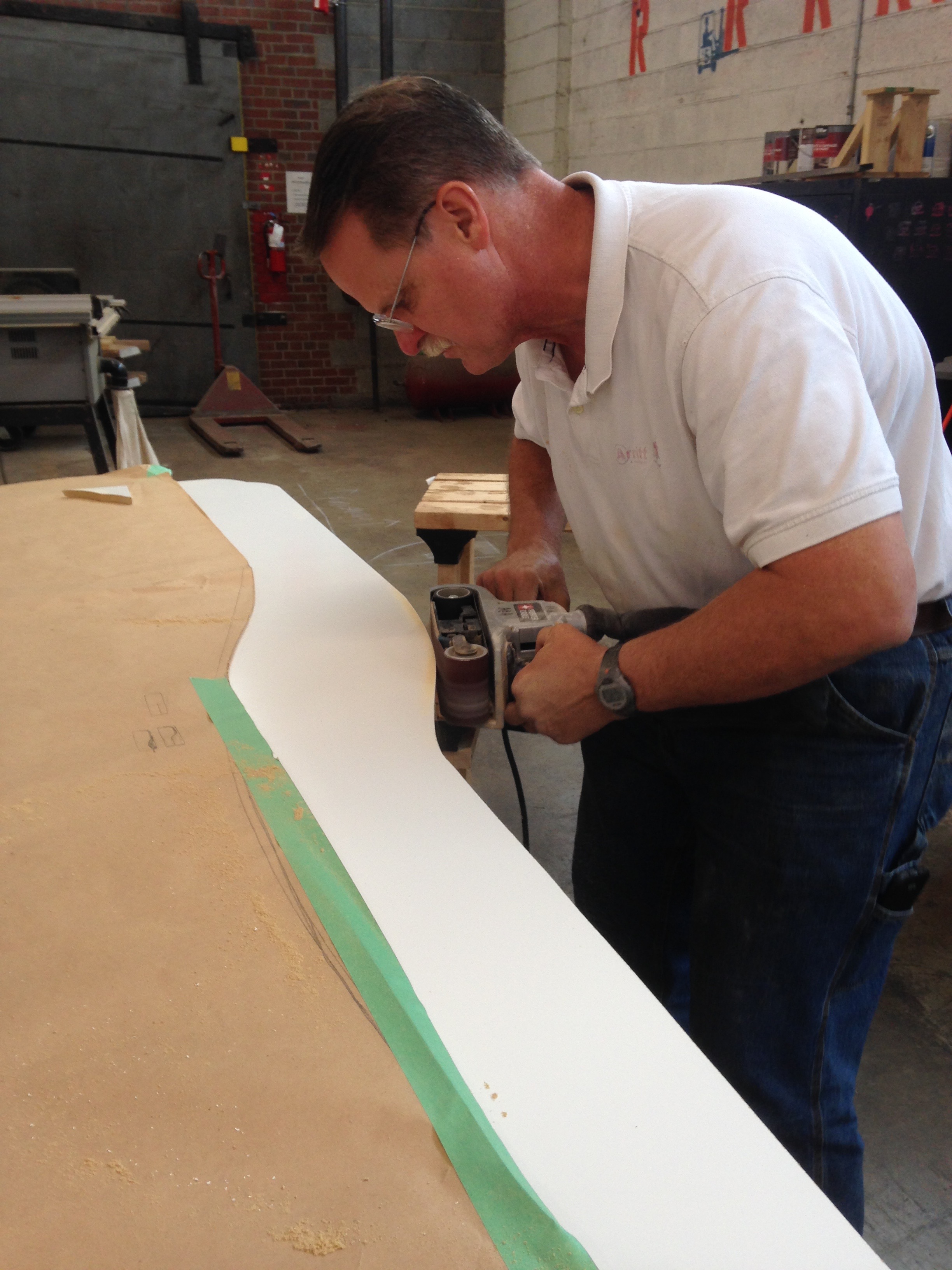 Jeff-the-angel helped me cut the shape I decided on with a jigsaw, and then cleaned it up with a belt sander and palm sander. 