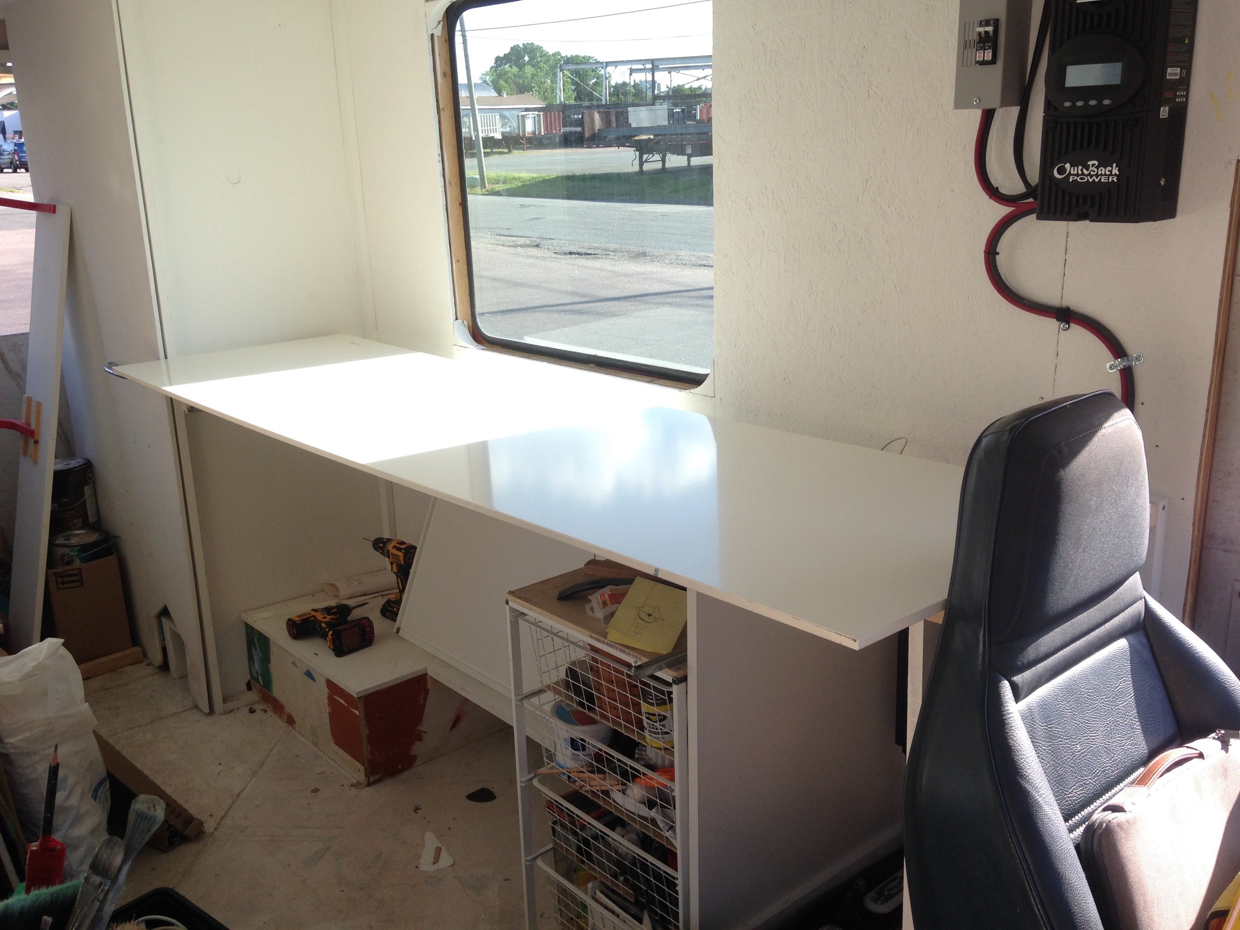 Test-fit! The boards I bought are very coincidentally nearly the perfect length - all I had to do was shape the front edge and knock out a little bite for the lip of the paint cabinet back there. 