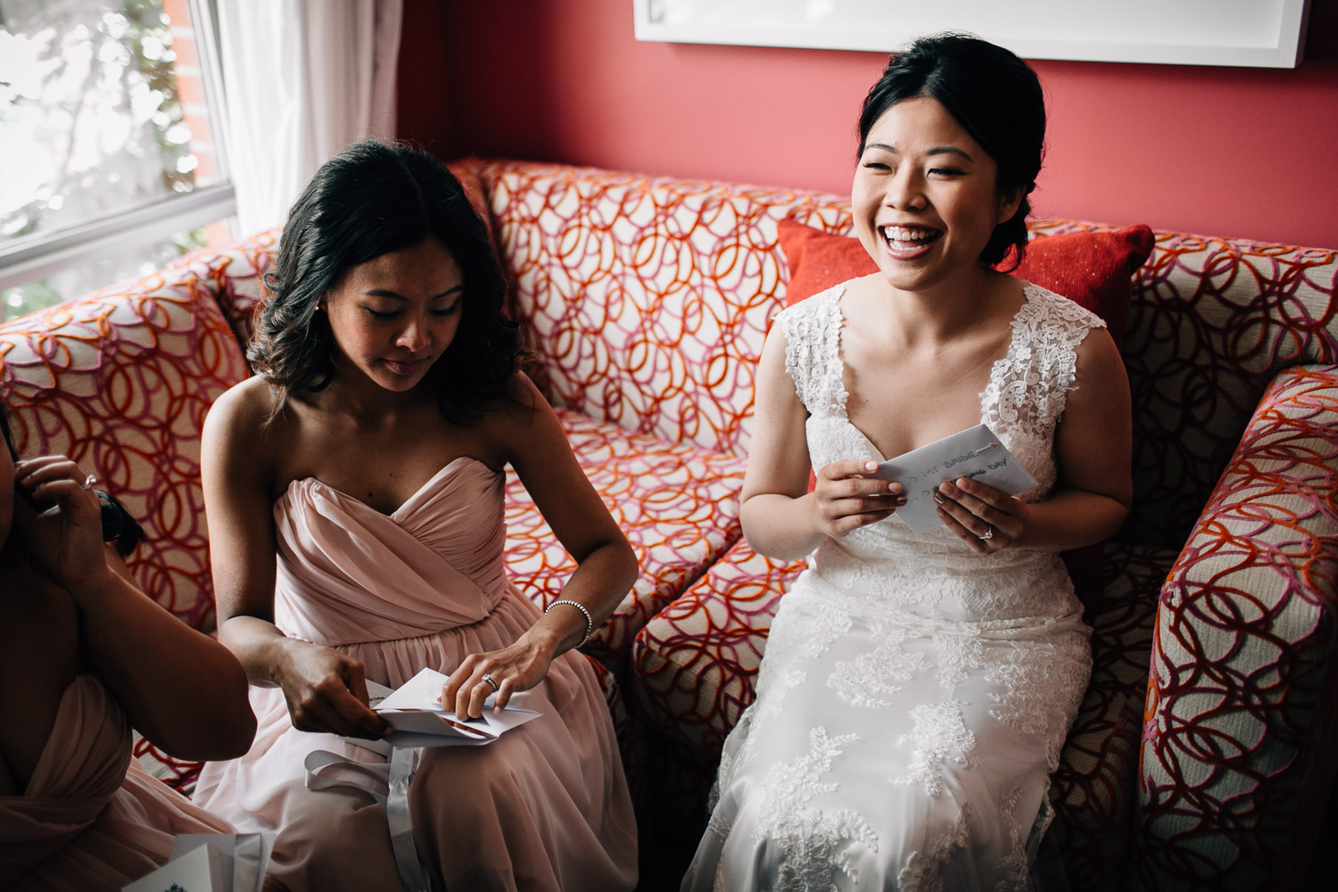 bride opening card from groom at opus hotel in yaletown vancouver bc wedding photography