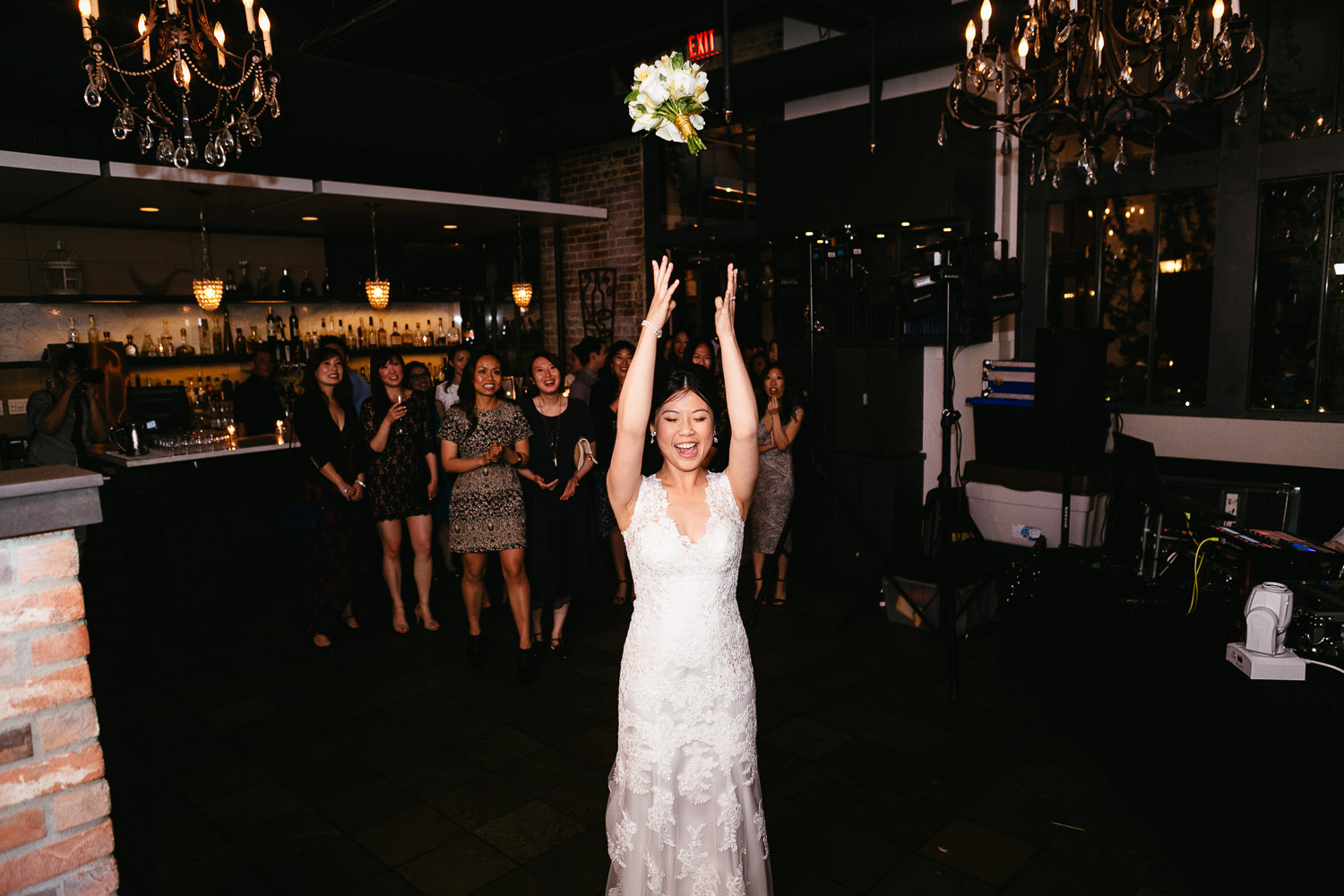 bouquet toss at brix and mortar vancouver wedding reception