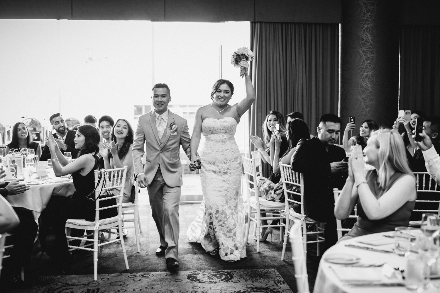 bride and groom reception entrance at pinnacle at the pier in north vancouver wedding photography