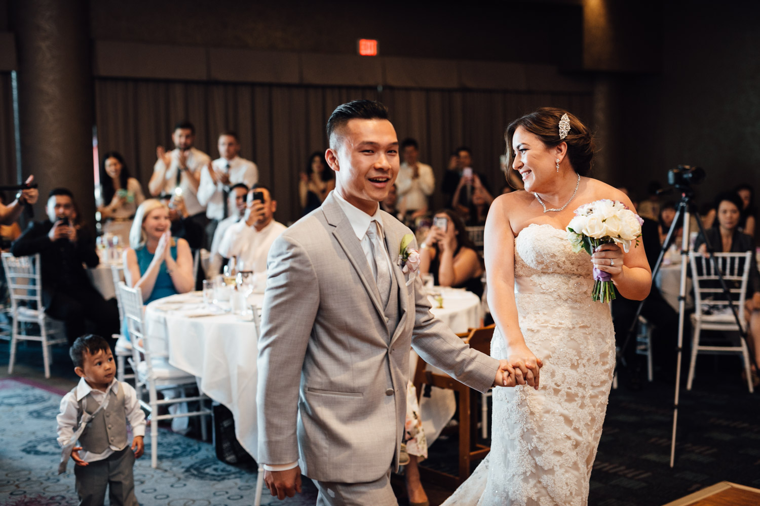 bride and groom reception entrance at pinnacle by the pier in north vancouver wedding photography