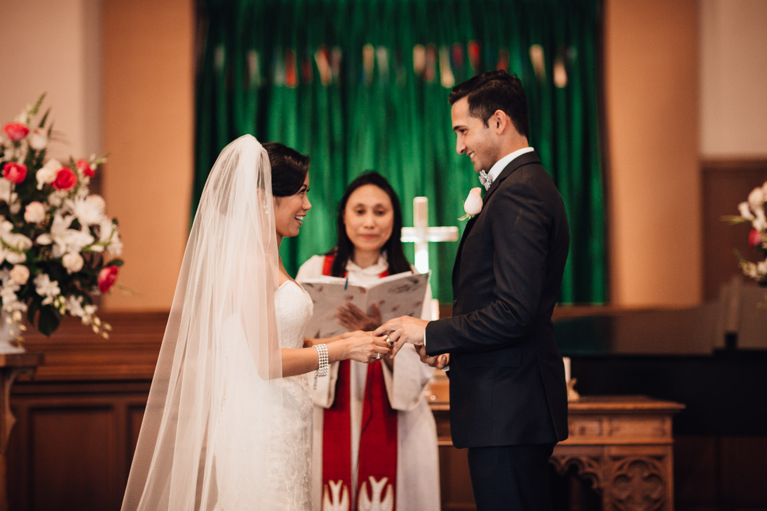 ring exchange during wedding at knox united church in vancouver bc