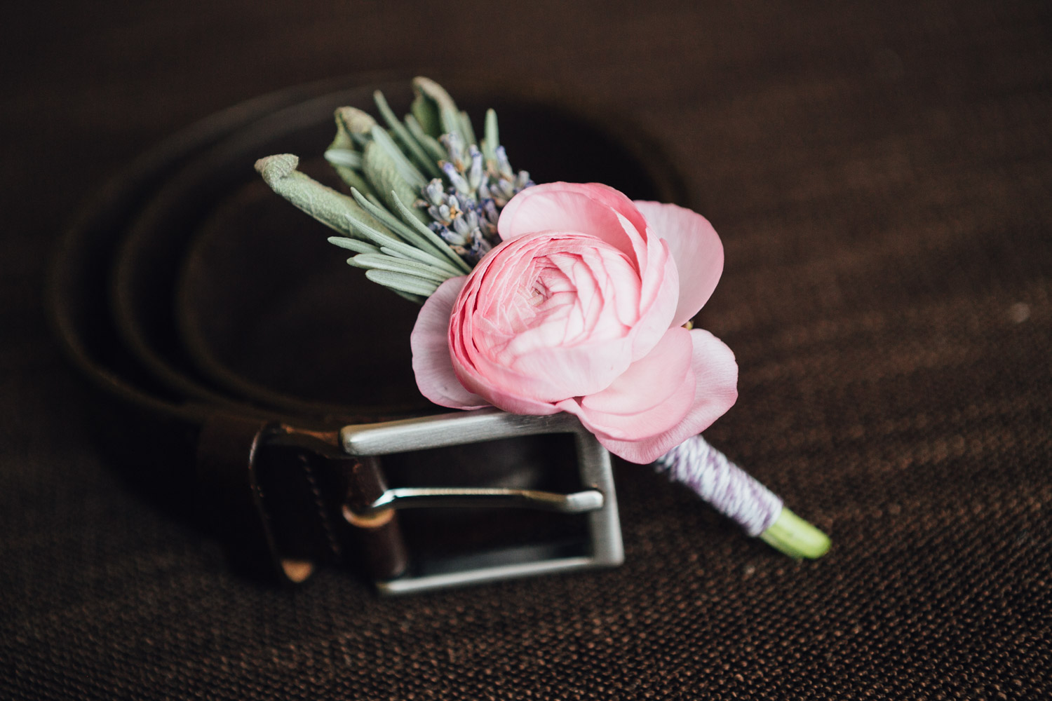 boutonniere and men's belt wedding day at river rock casino hotel photography