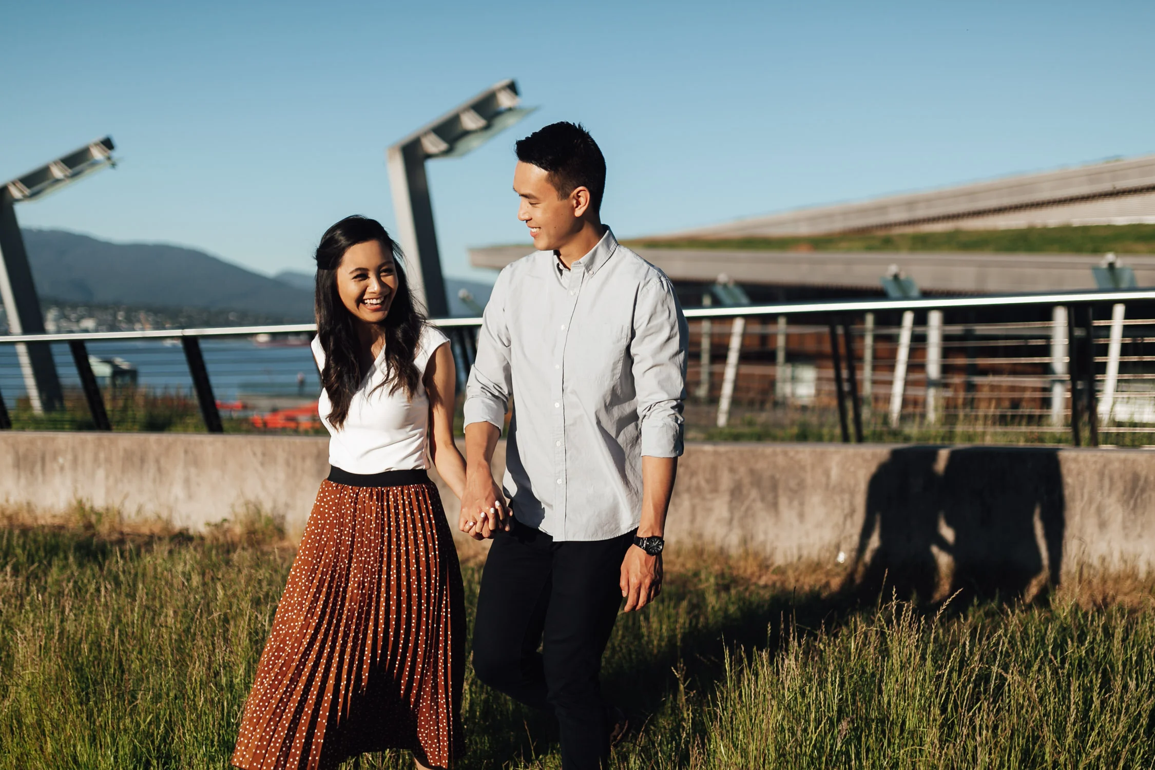 coal harbour engagement photography in vancouver bc during sunset marine building