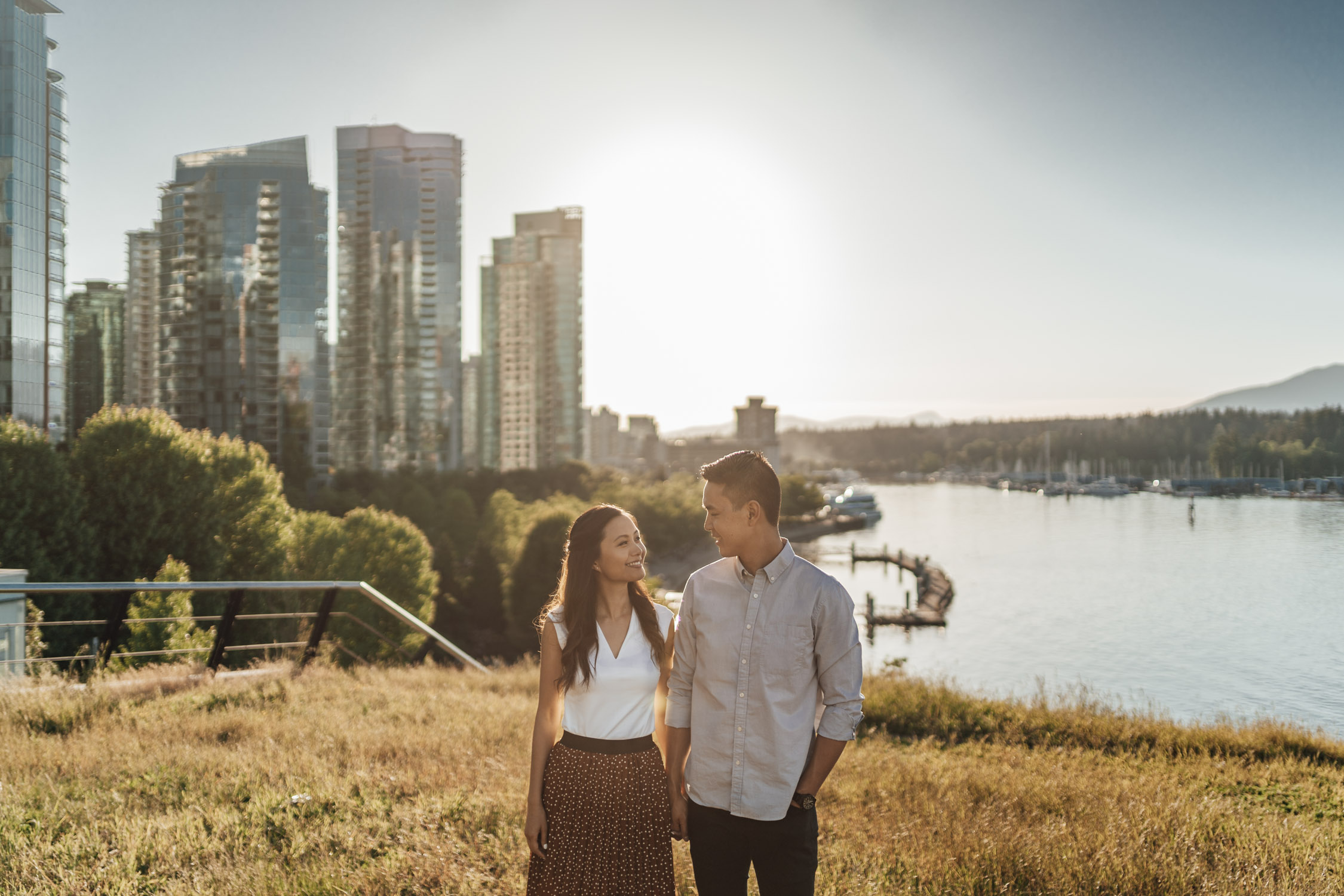 coal harbour engagement photography in vancouver bc during sunset marine building