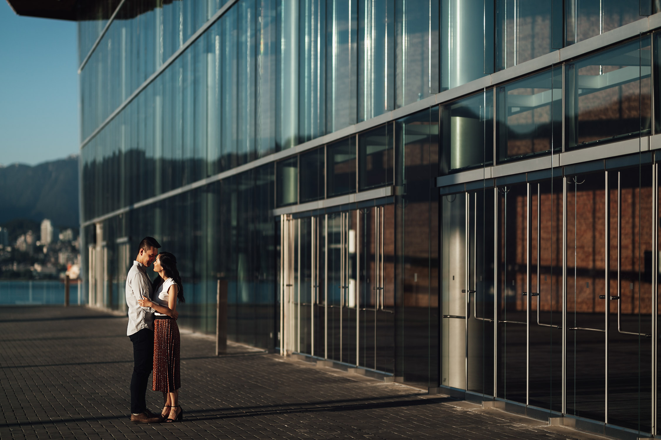 coal harbour engagement photography in vancouver bc during sunset marine building
