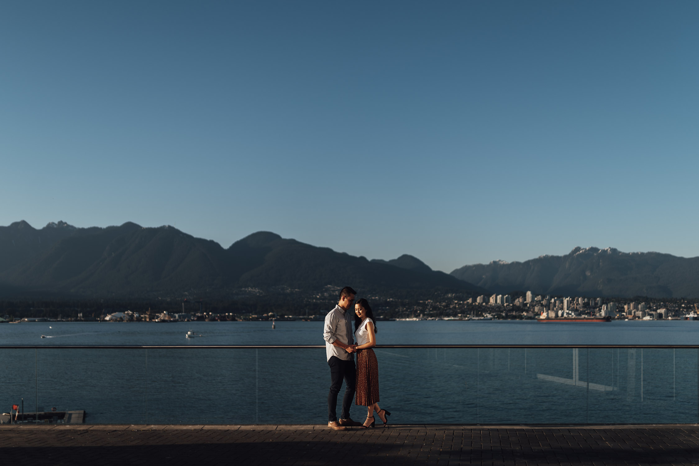 coal harbour engagement photography in vancouver bc during sunset marine building