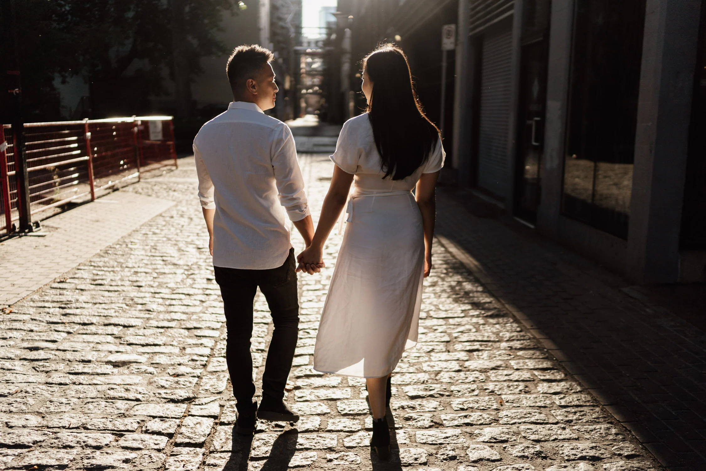 gastown engagement photography during golden hour in the summer located in vancouver bc canada